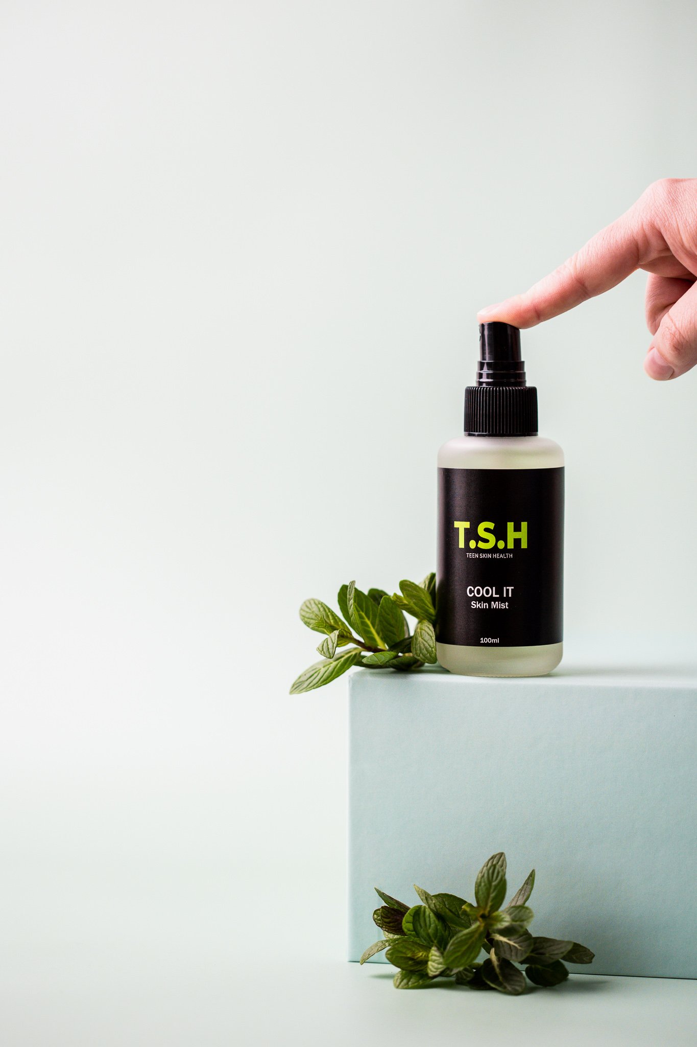 Canberra product photographer - hands squeezes skincare product bottle