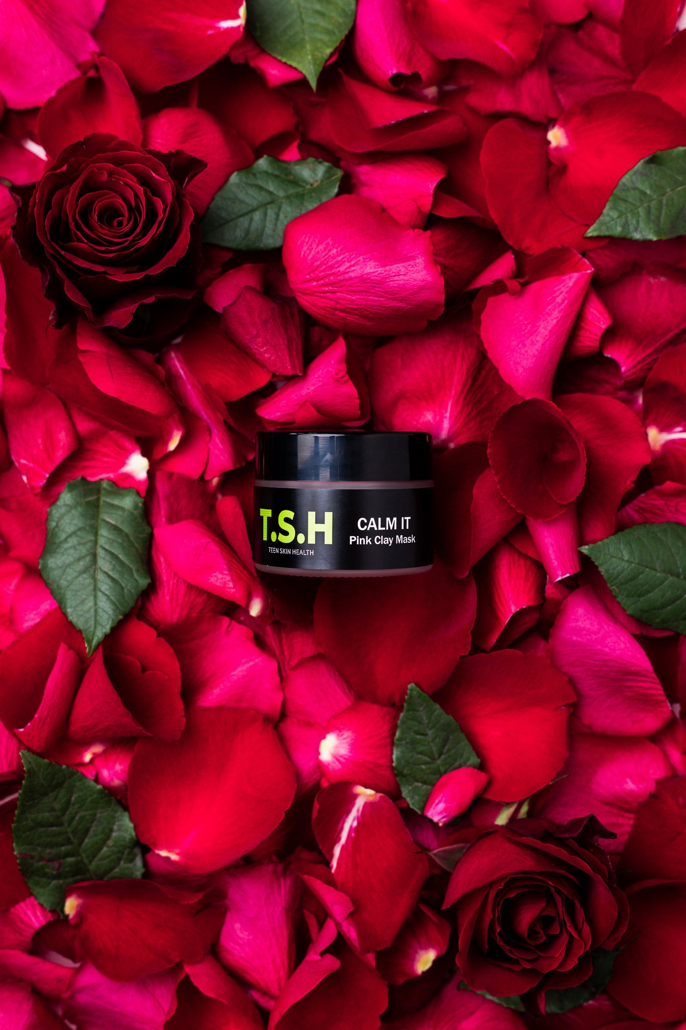Canberra product photography - skincare product in bed of rose petals