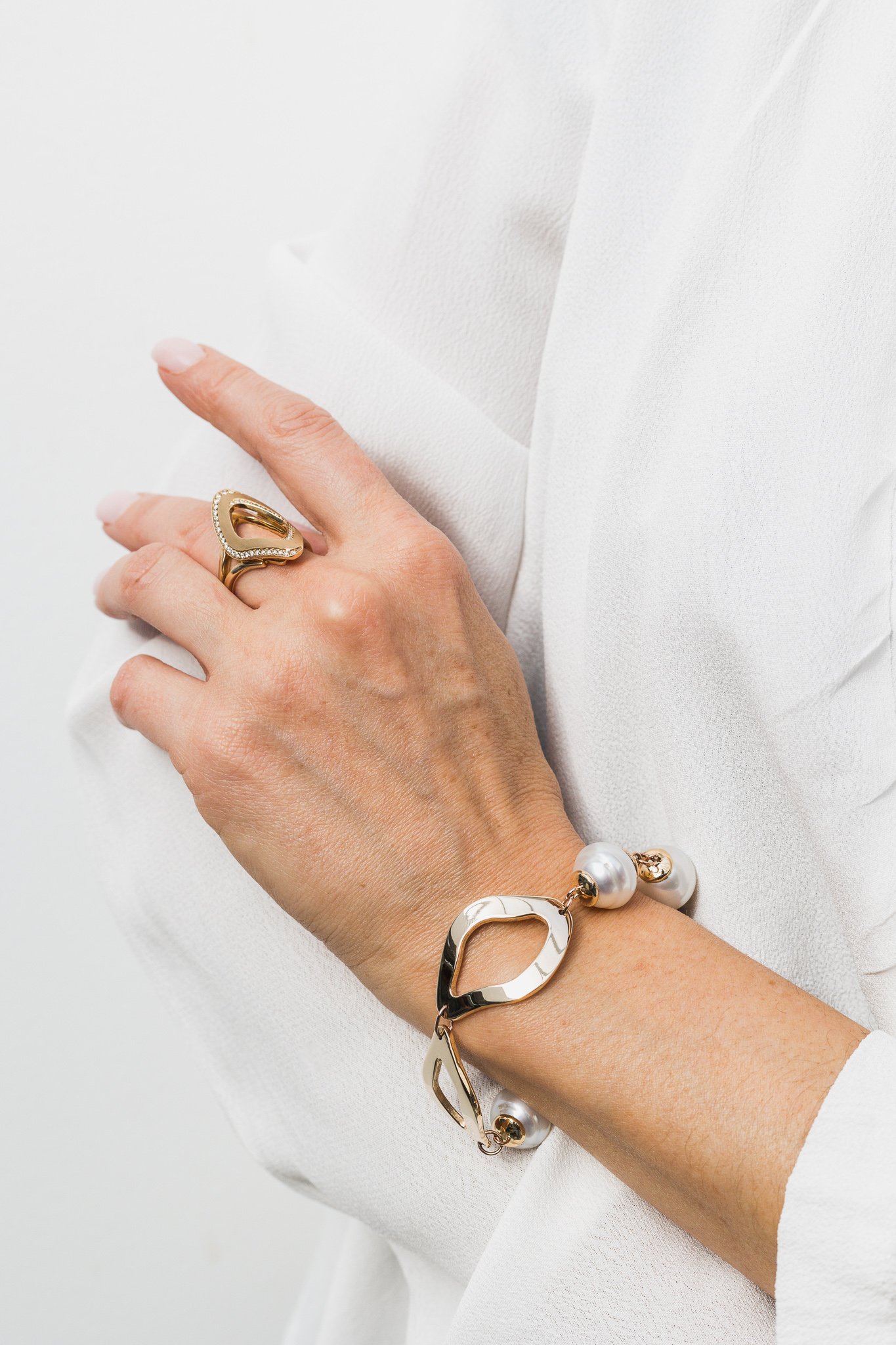 Canberra product photographer - jewellery against soft white clothes