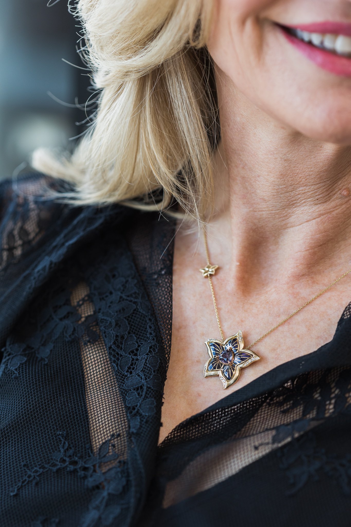 Canberra product photography - smiling woman wears necklace