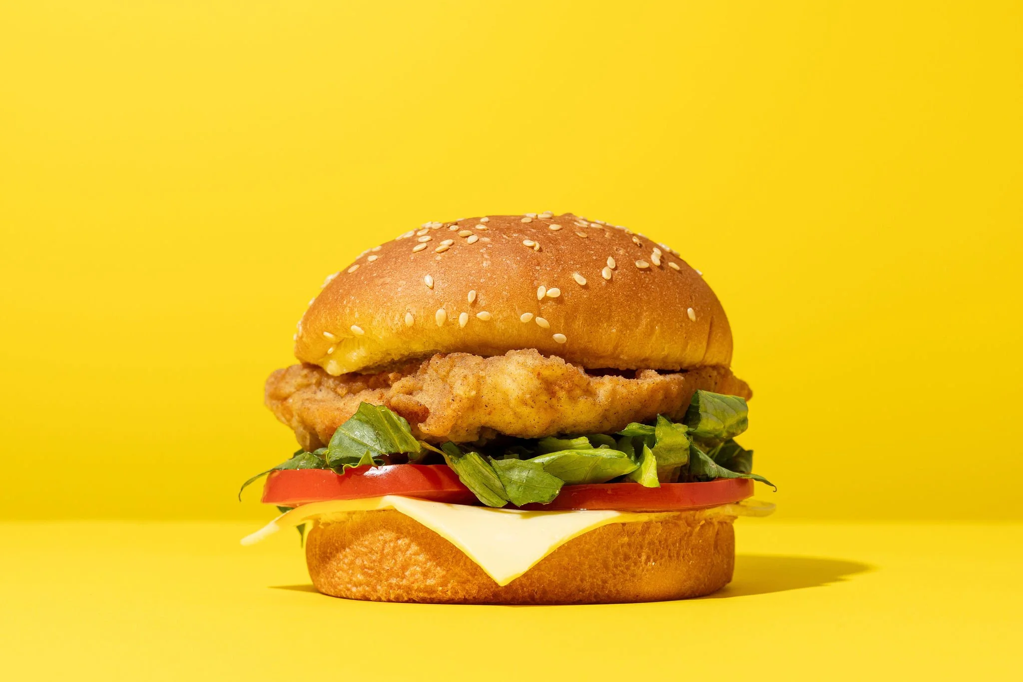 Canberra food photographer - fried chicken burger on yellow background
