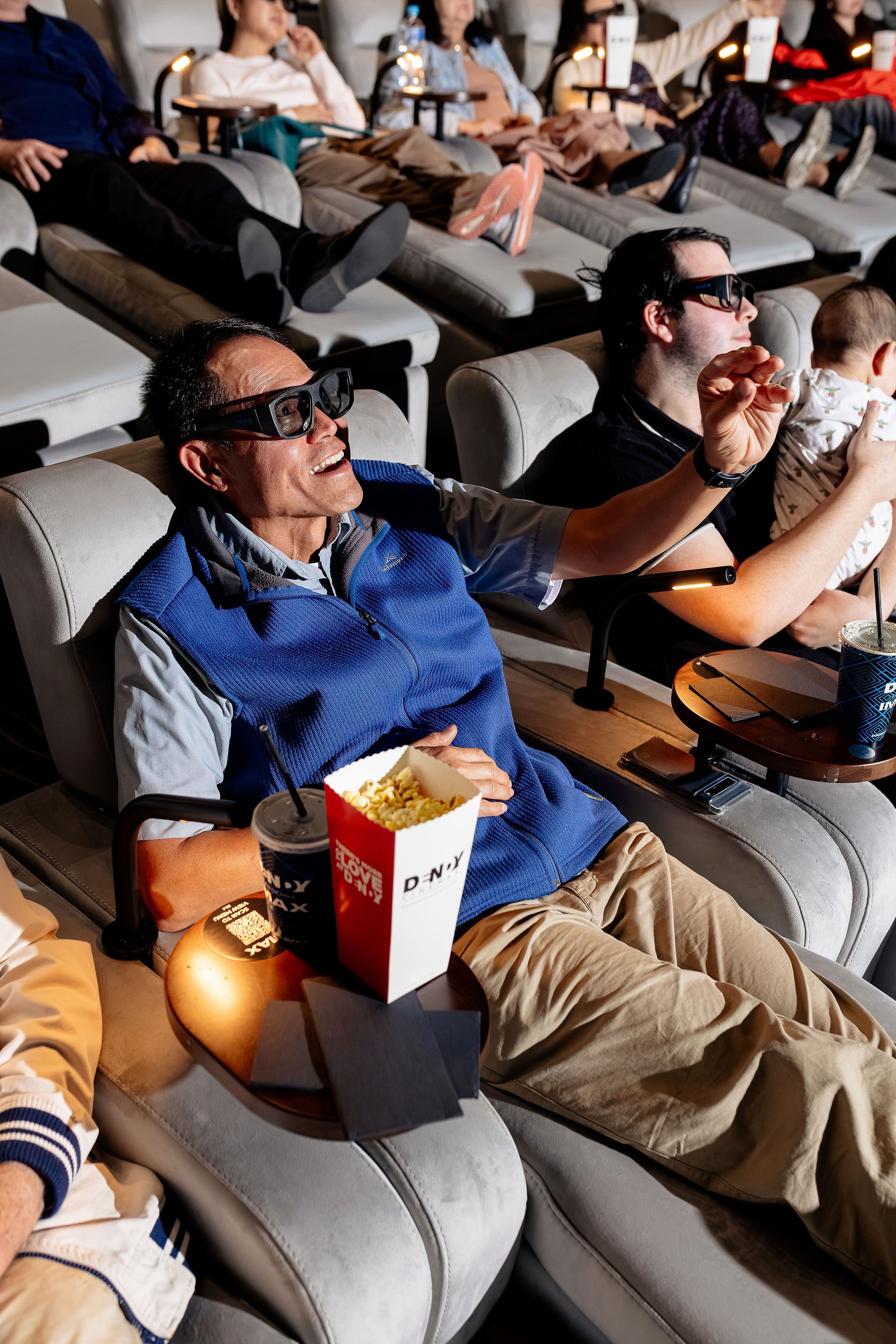 Canberra food photography - man reaching out to cinema screen