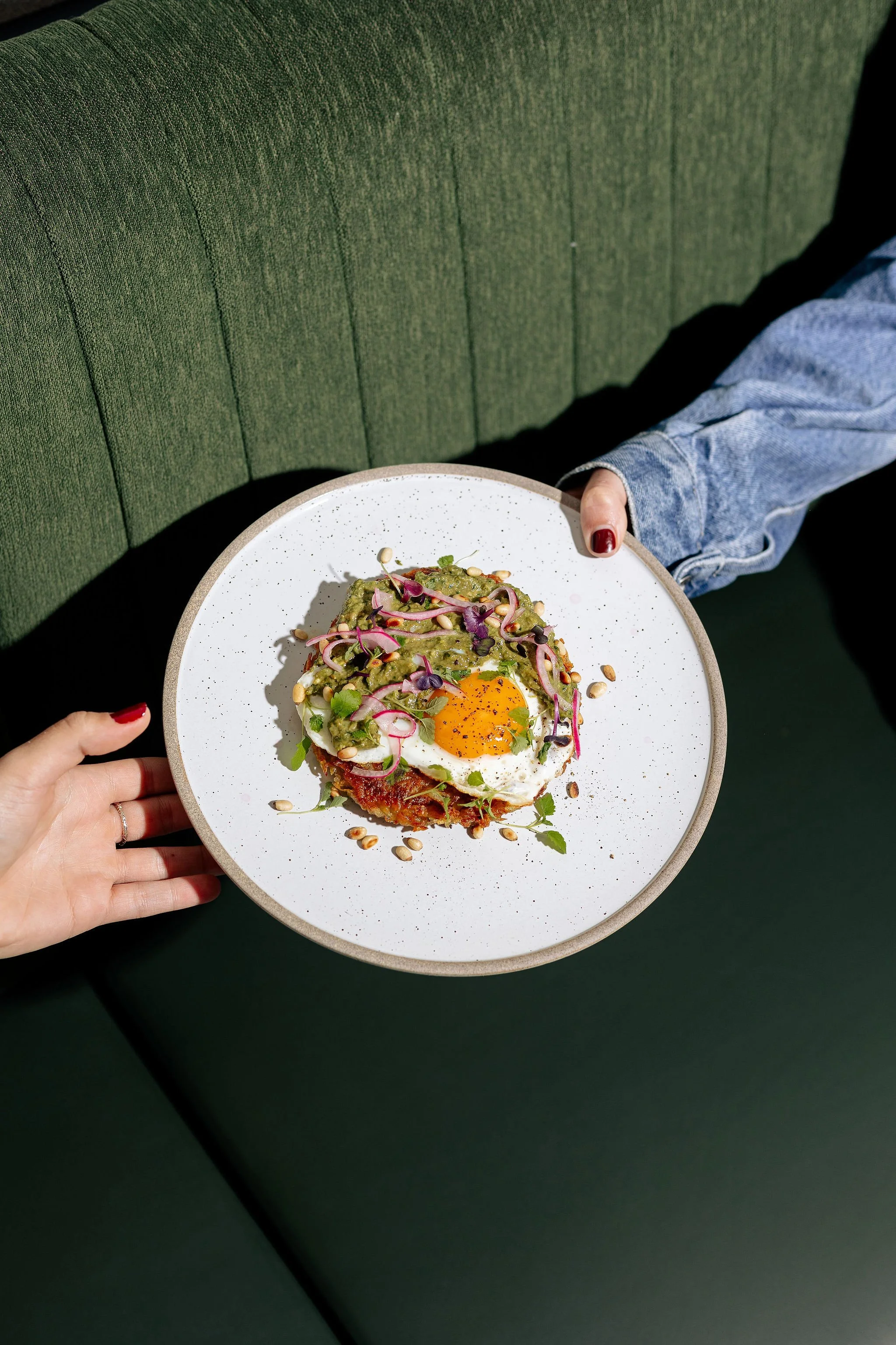 Canberra food photography - hands passing plate of food