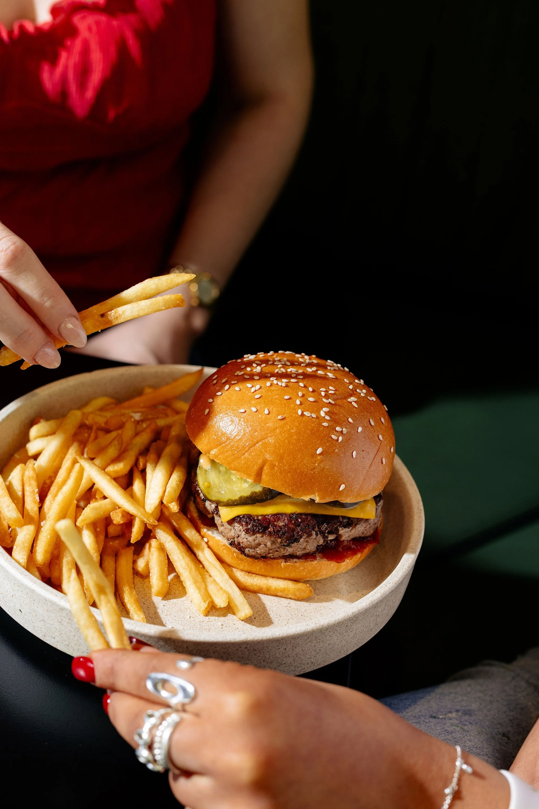 Canberra food photography - woman reaches for fries