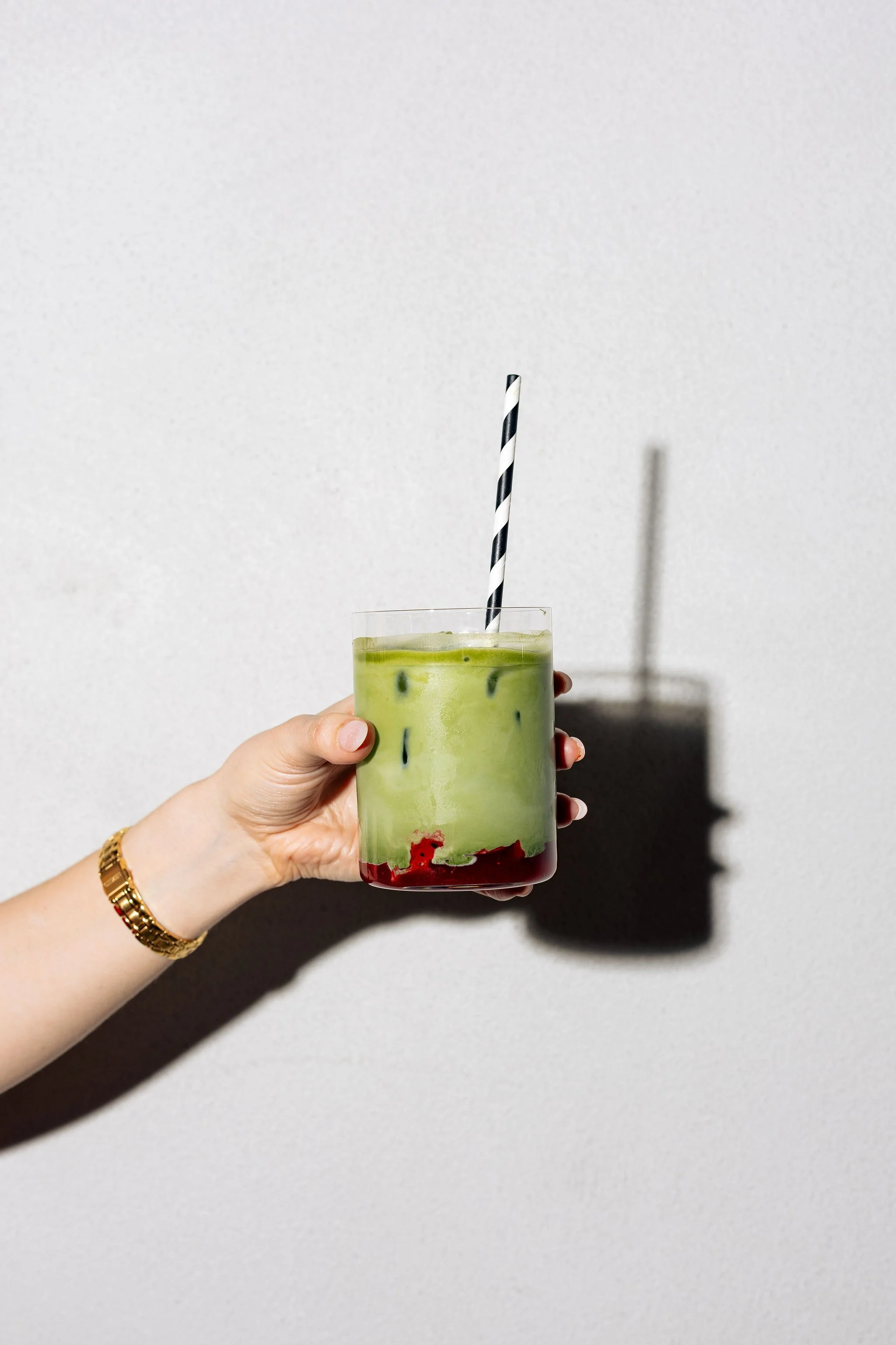 Canberra food photographer - hand holds strawberry matcha