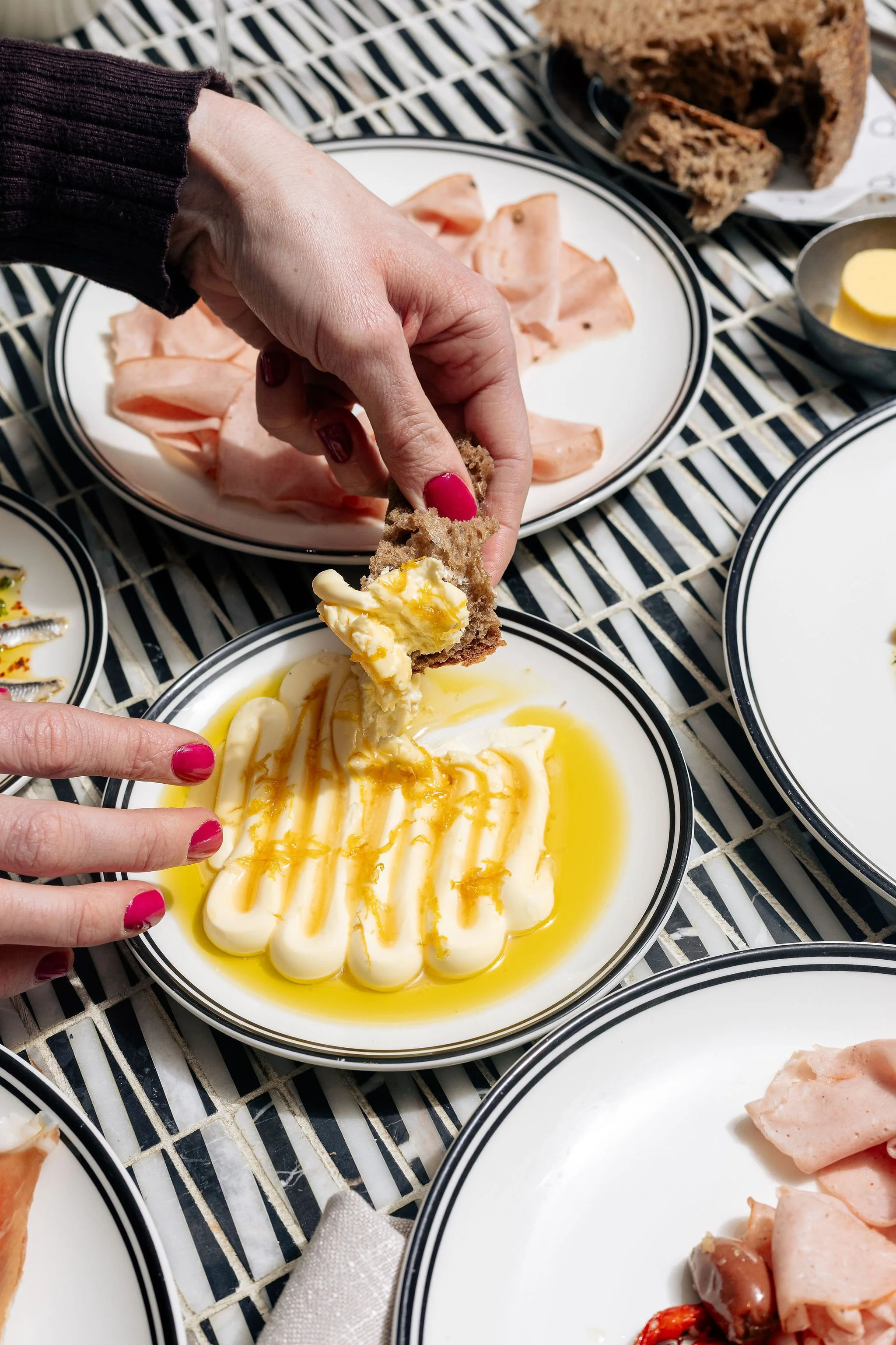 Canberra food photography - dipping bread into cheese