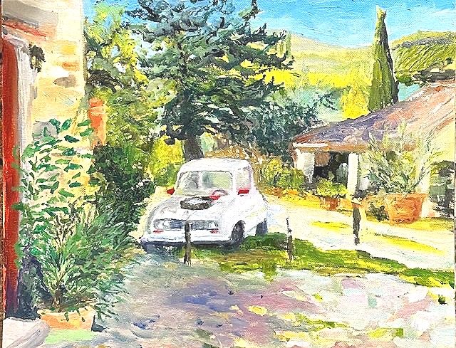 small white Renault Duccio is the owner parked in a driveway on a sunny day in Tuscany