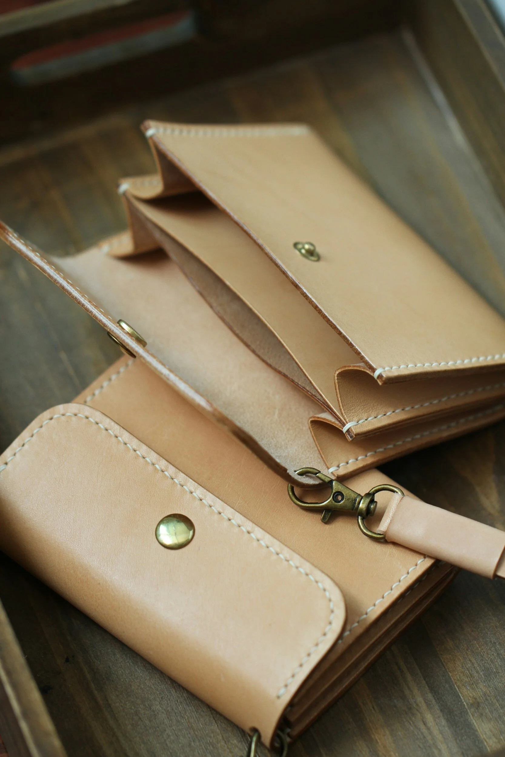 Image shows two empty leather wallets