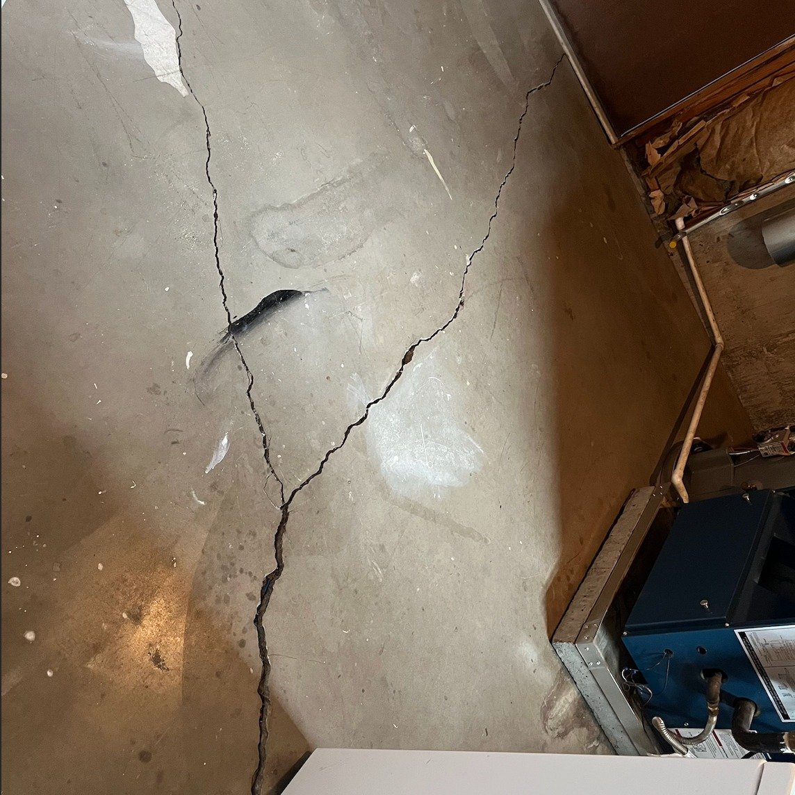 Here is a before-and-after photo of a crack repair using carbon fiber stitches bonded with a high-performance two-part epoxy by Structural Reinforcement Solutions.

Unlike traditional methods that fill the crack, carbon fiber stitching ties both side