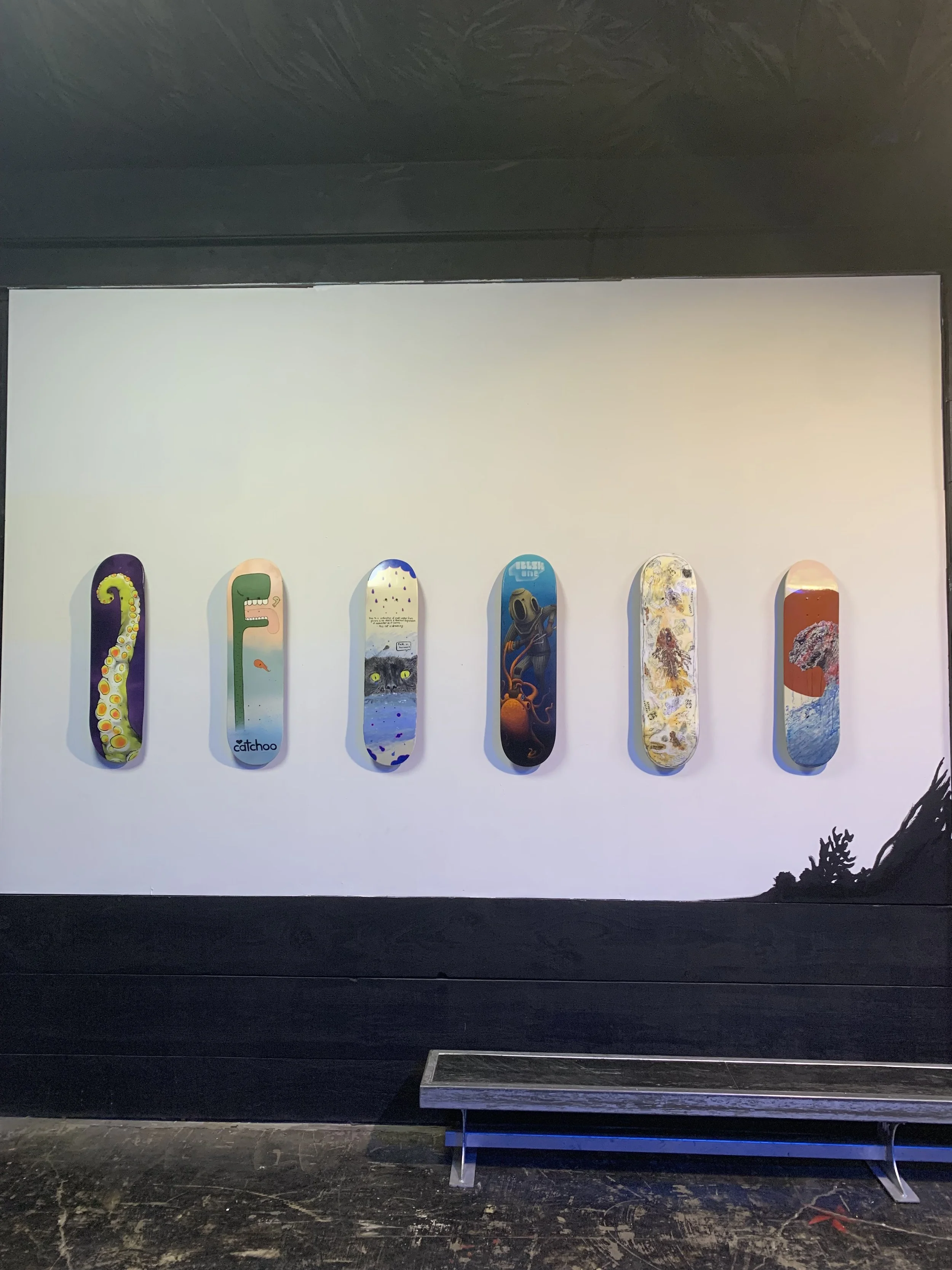 Custom Painted Skateboard Curation and Hand painted mural