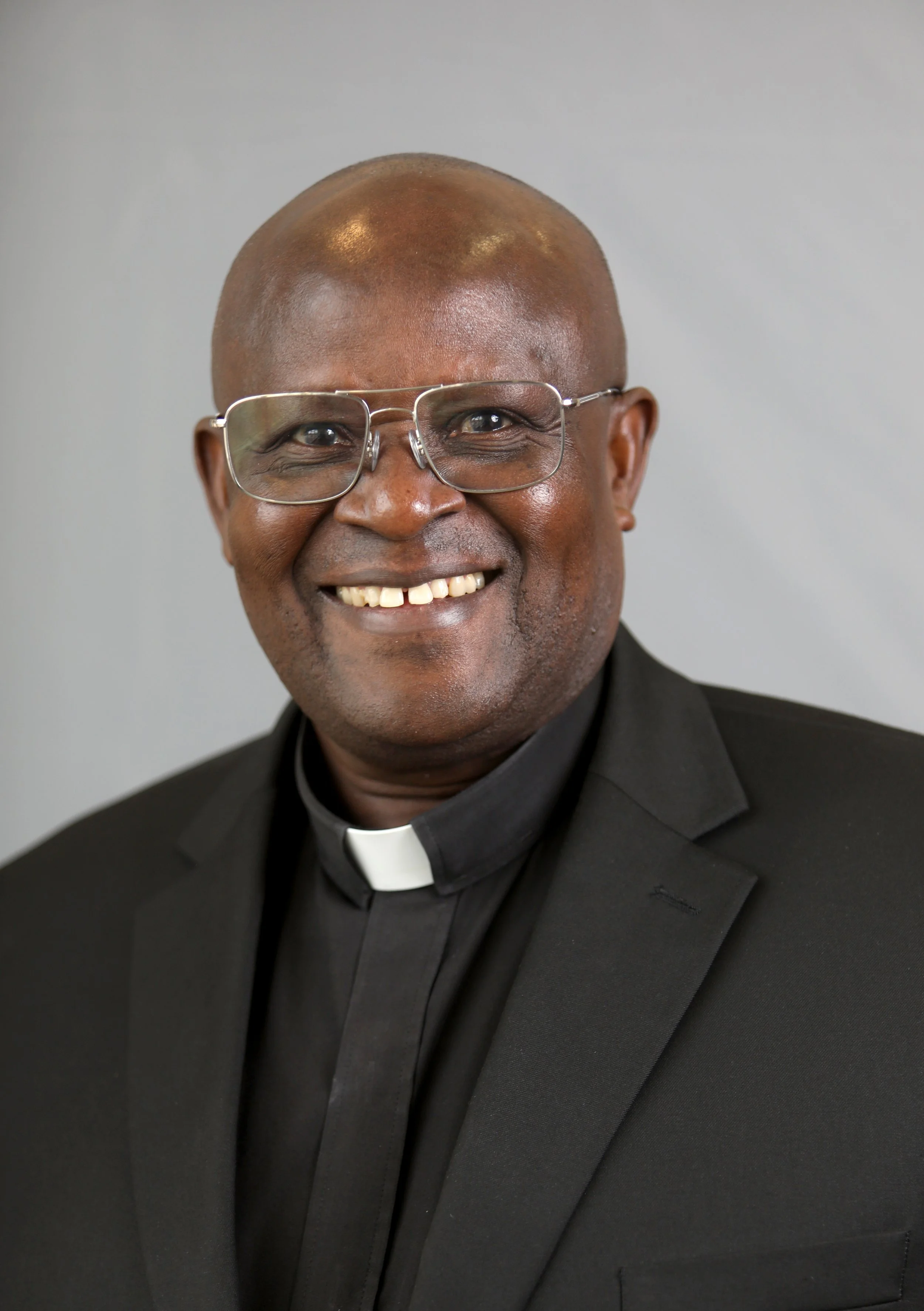 Father Rogers Byambaasa, AJ