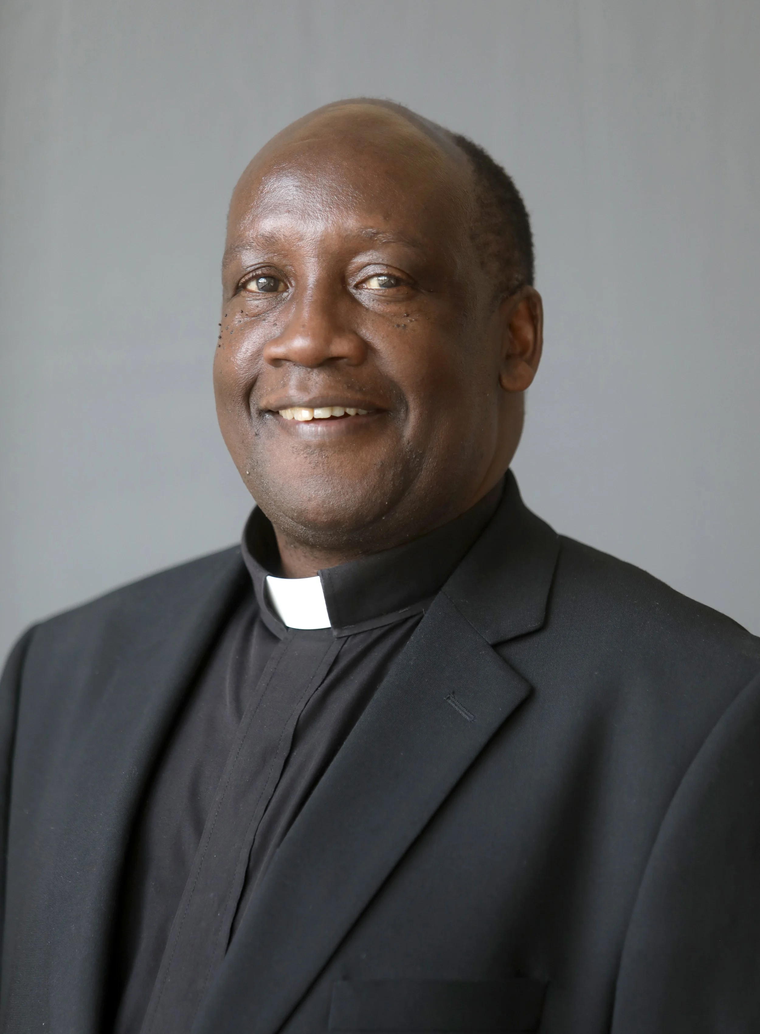 Father John Bosco Mujuni