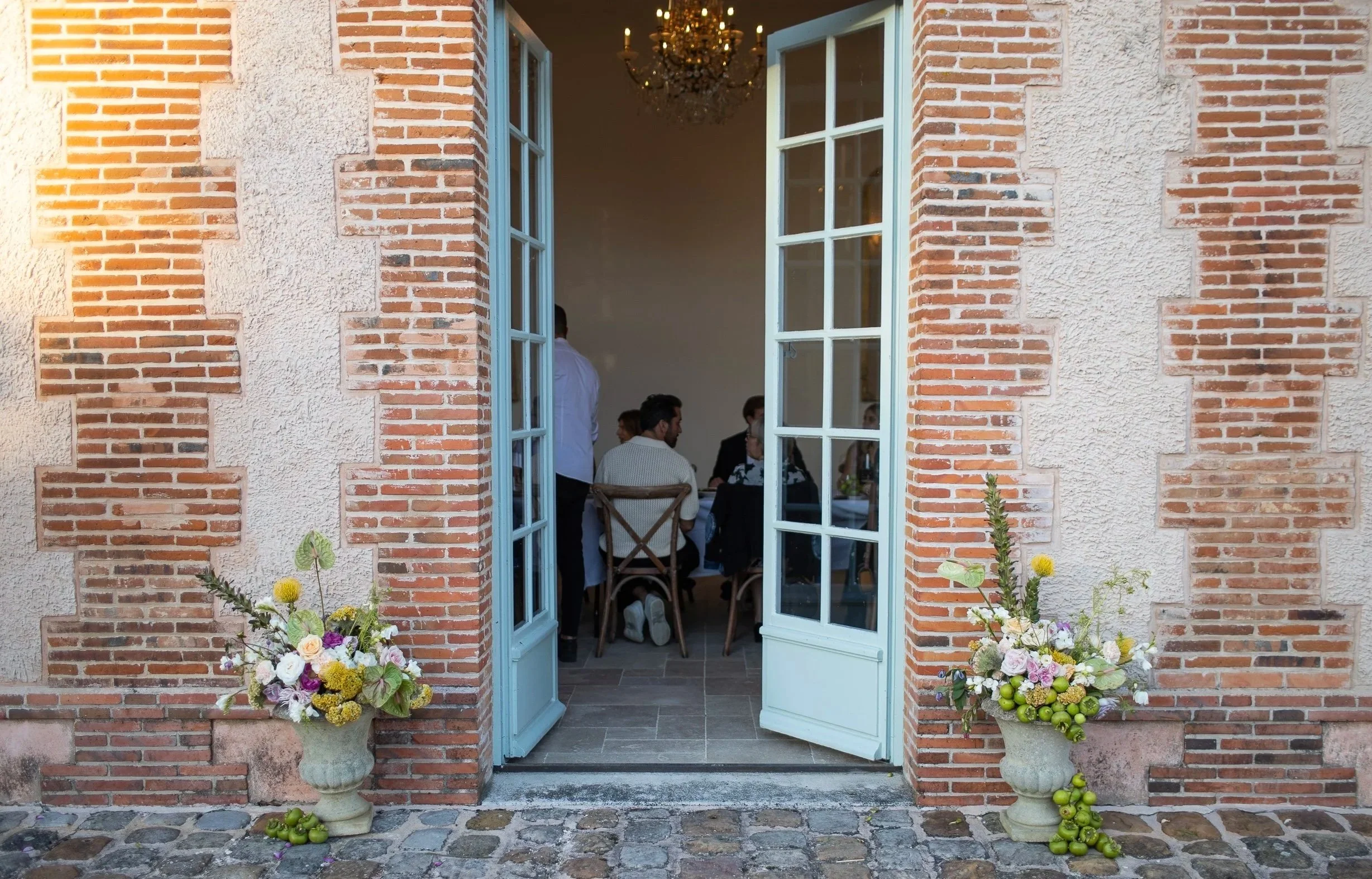 Wedding dinner space and commercial kitchen available for guests and private culinary events at Château des Joncherets near Paris, France.
