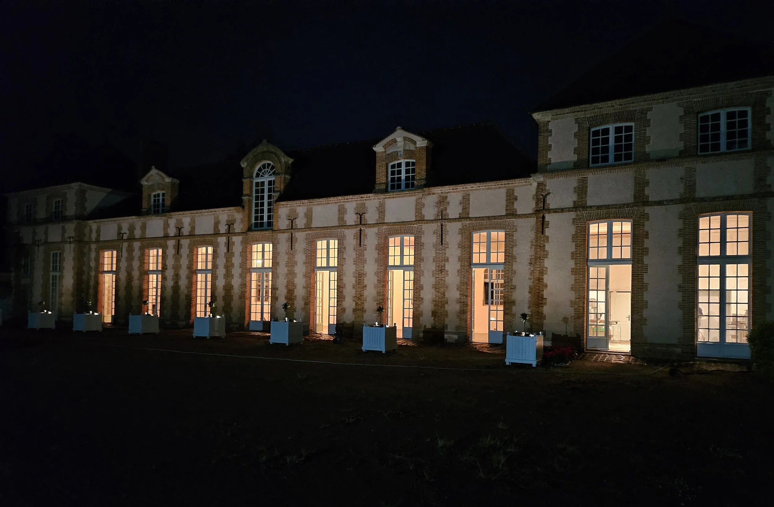 Wedding dinner space and commercial kitchen available for guests and private culinary events at Château des Joncherets near Paris, France.