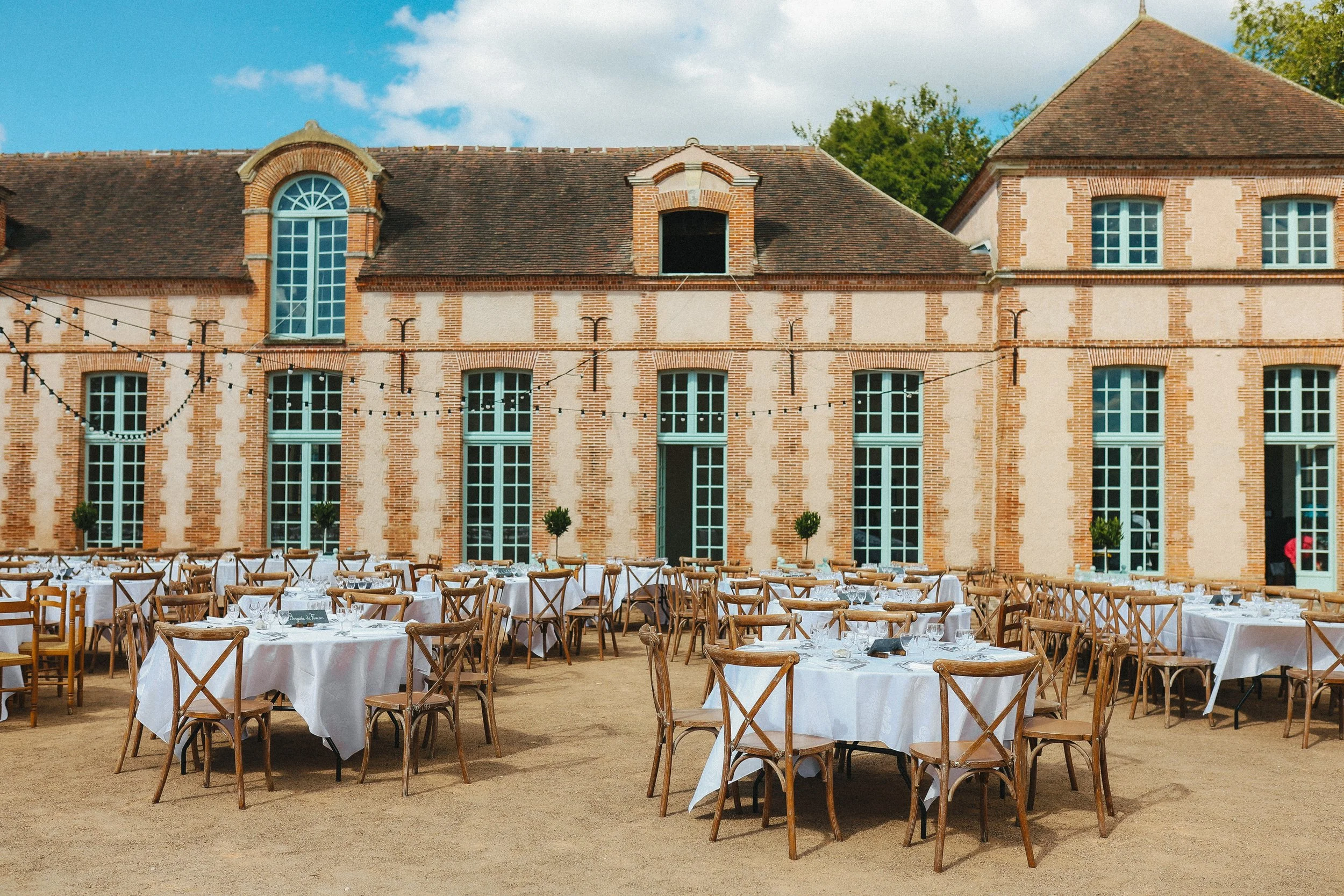 Wedding dinner Orangerie space and commercial kitchen available for guests and private culinary events at Château des Joncherets near Paris, France. Gabriel Glas glassware, Noon & Moon tableware.