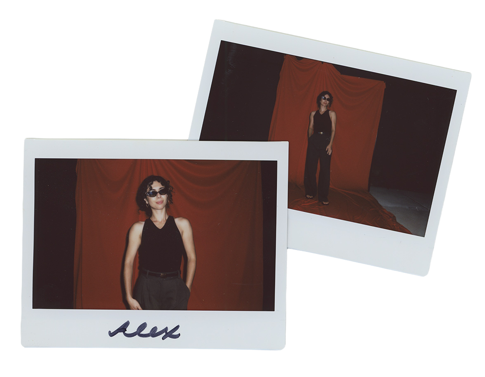 Two overlapping Polaroid photographs of Alex, a short woman with a proportionally long torso and short legs, wearing a black halter top and pants.