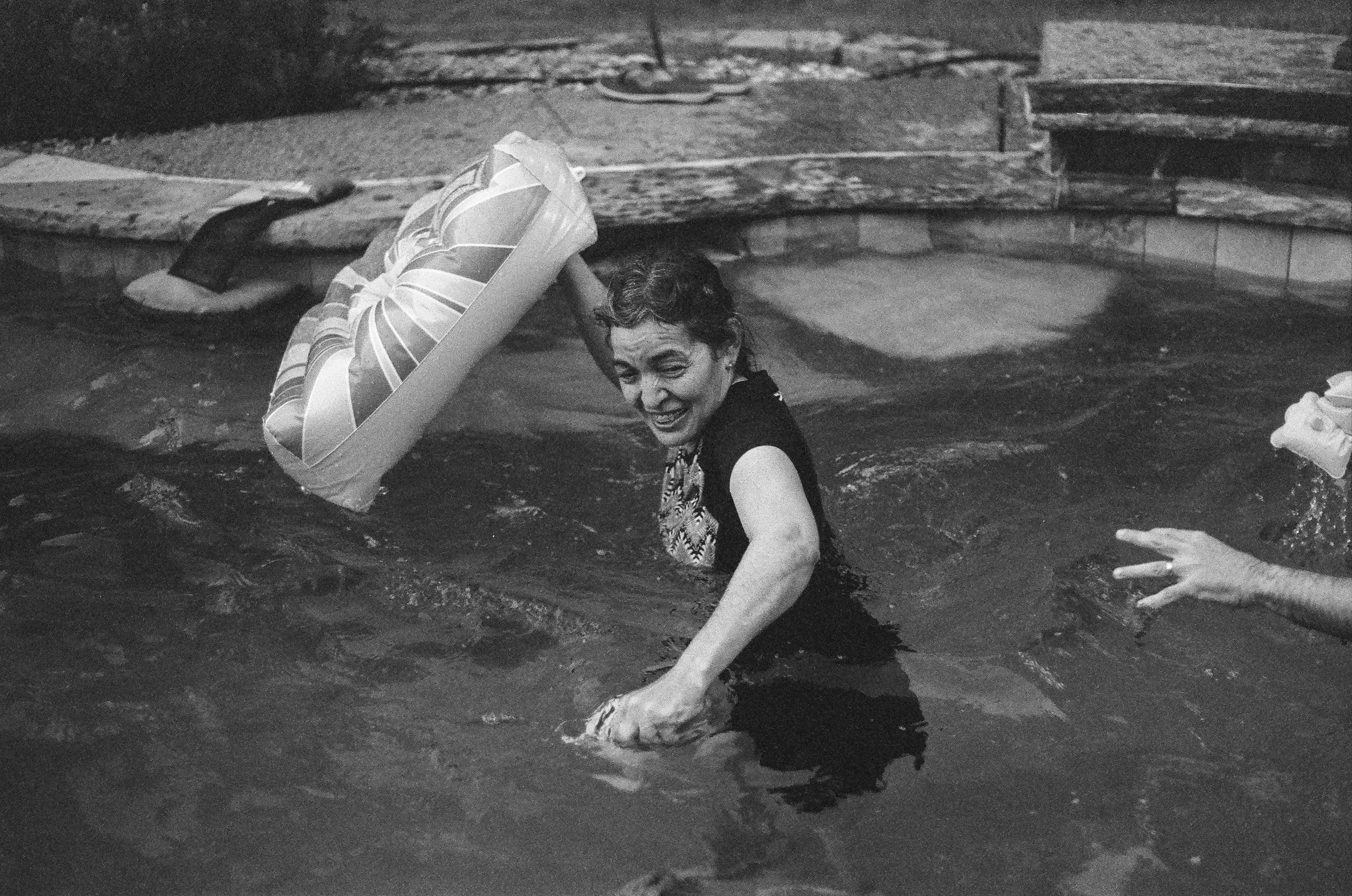 My mom getting way too into a fight in the pool. Captured the moment before she slammed Luis's dad in the face with an inflatable cornhole board. 