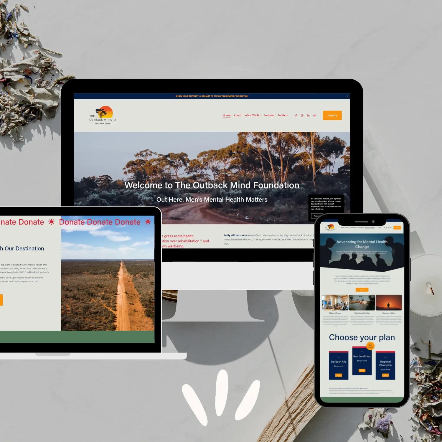 The Outback Mind Foundation website shown on desktop computer, laptop and iPhone, designed by Gold Coast Squarespace website designer - Kyah Digital.