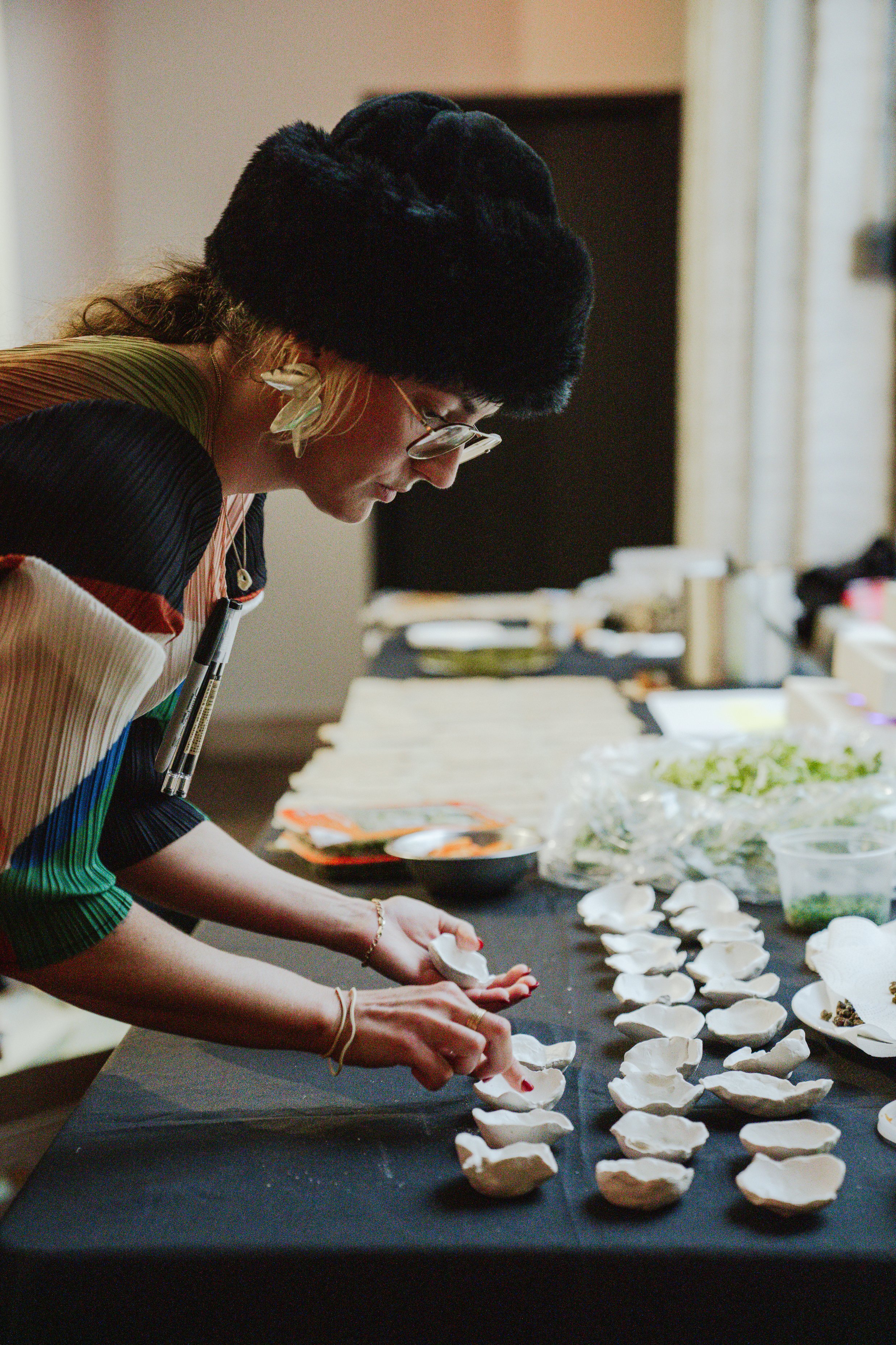Plating crudo in custom handmade ceramic dishes