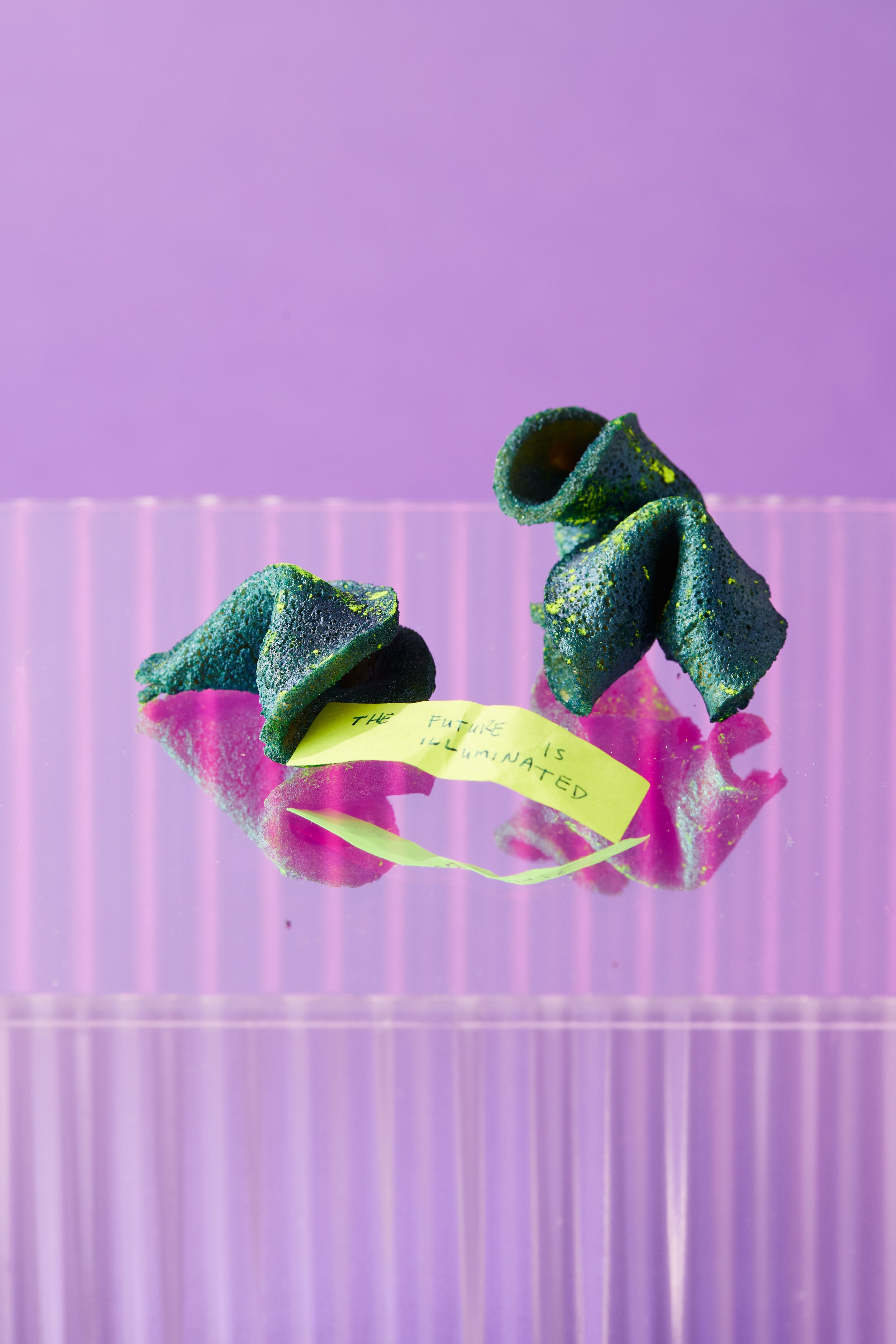 Custom chrome glow-in-the-dark fortune cookies for Spoiled Child X Jeremy Scott