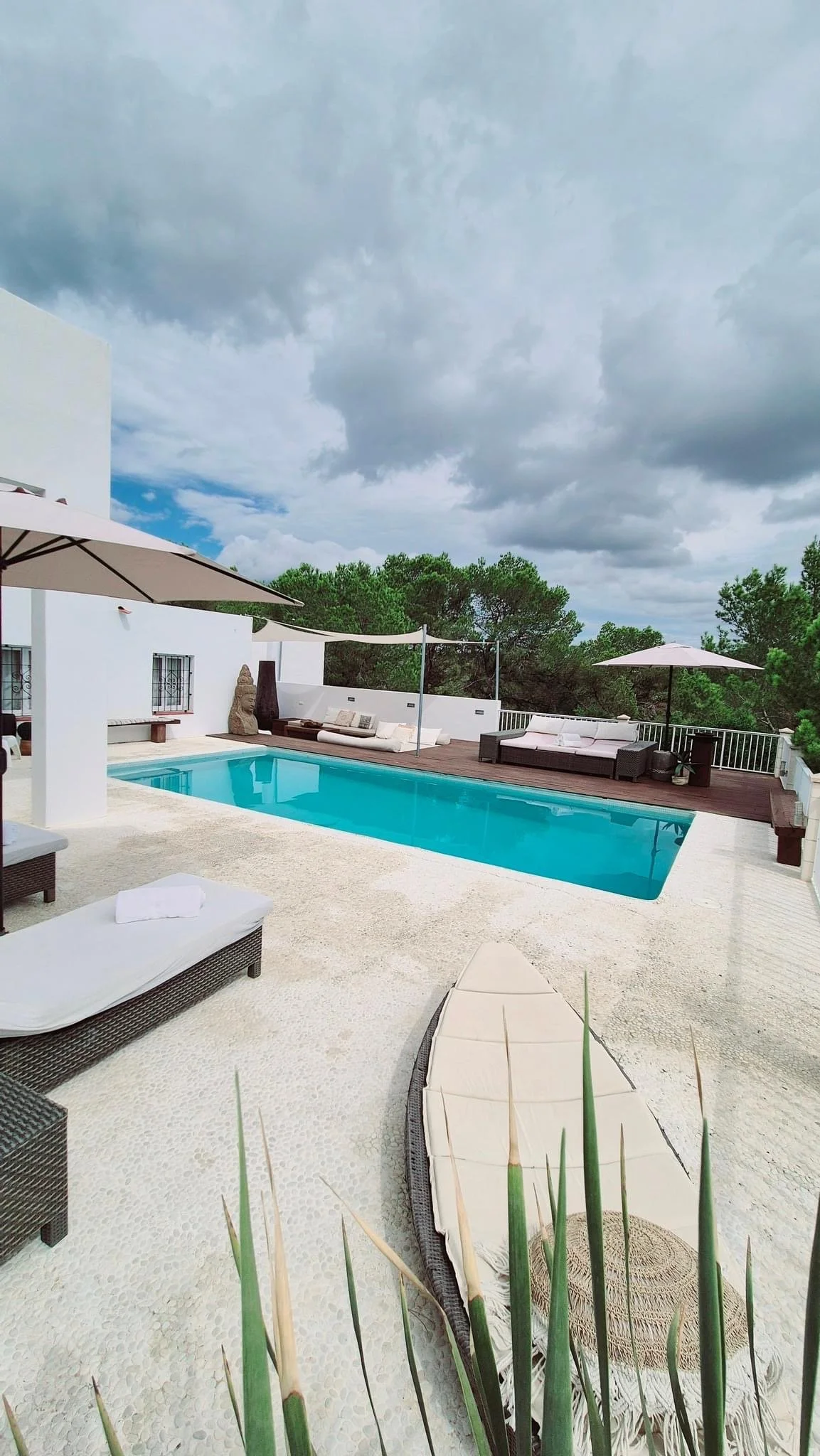 Luxury villa in Ibiza overlooking sea and mountains home of the Inner Muse Retreat by Michelle Ariel Luxery Finca Ibiza luxe Ibiza Sea nature and swimmingpool outside dining sunbeds