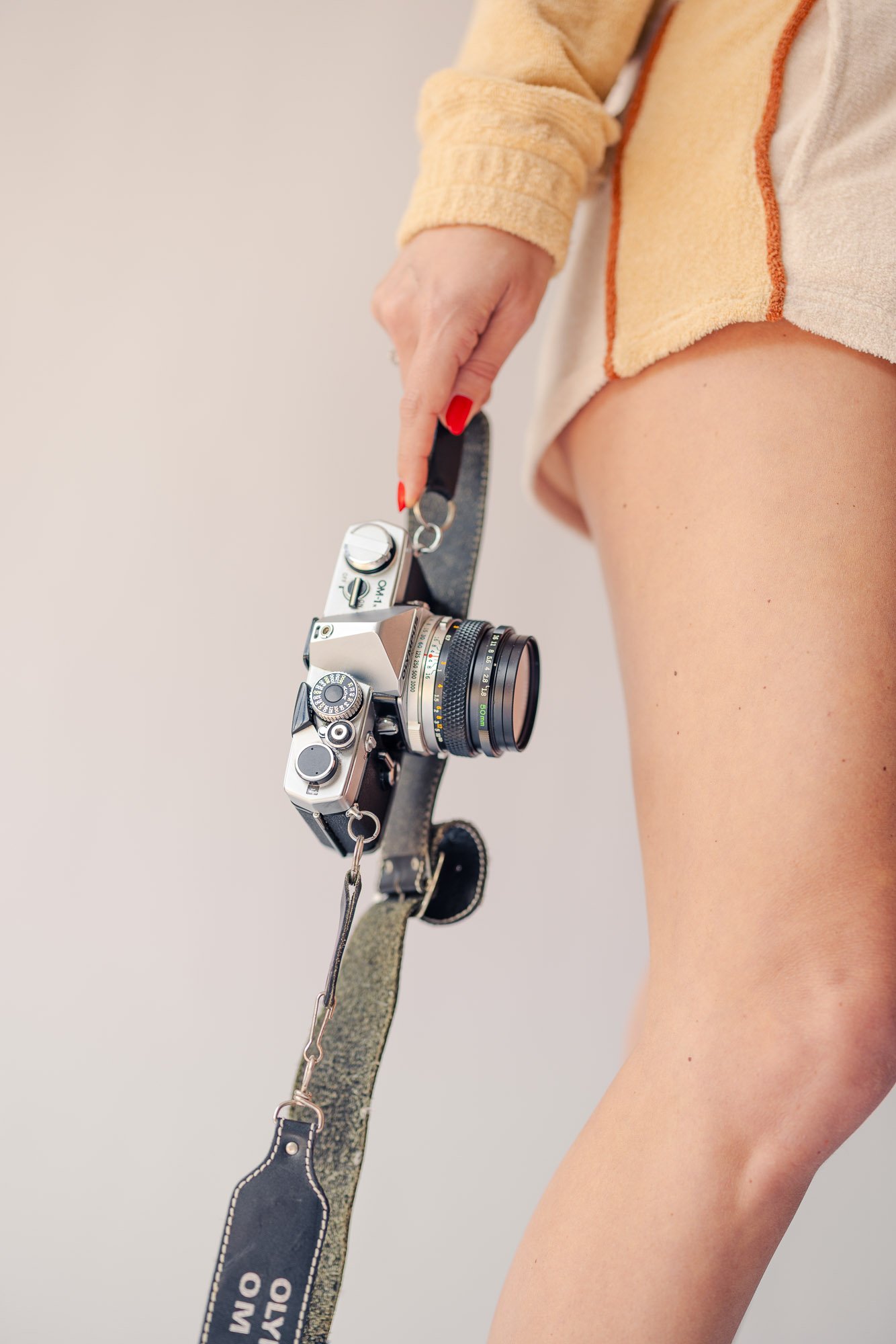 female photographer holding vintage camera lifestyle personal branding photography