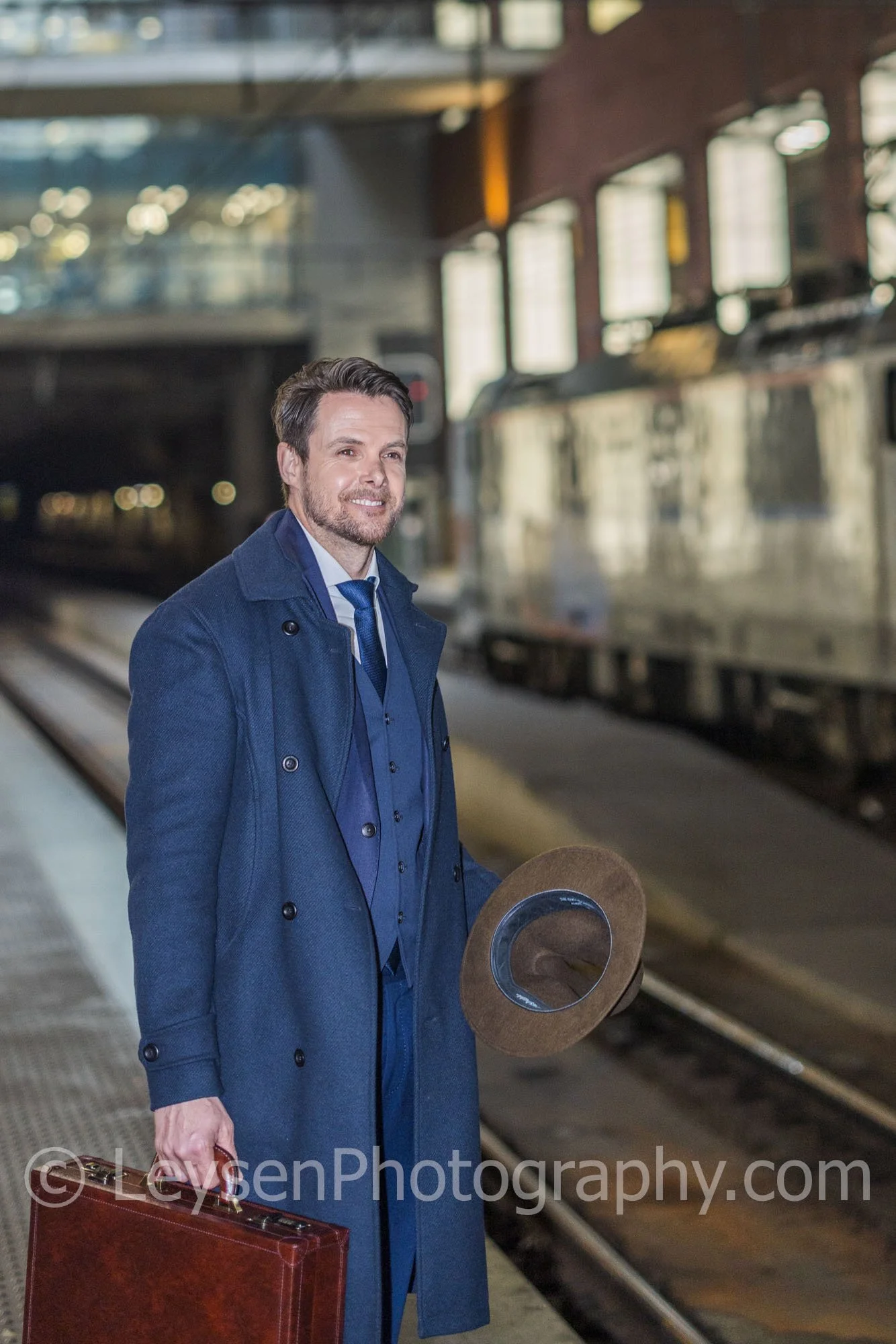 Businessman Waiting for Train with Leather Briefcase