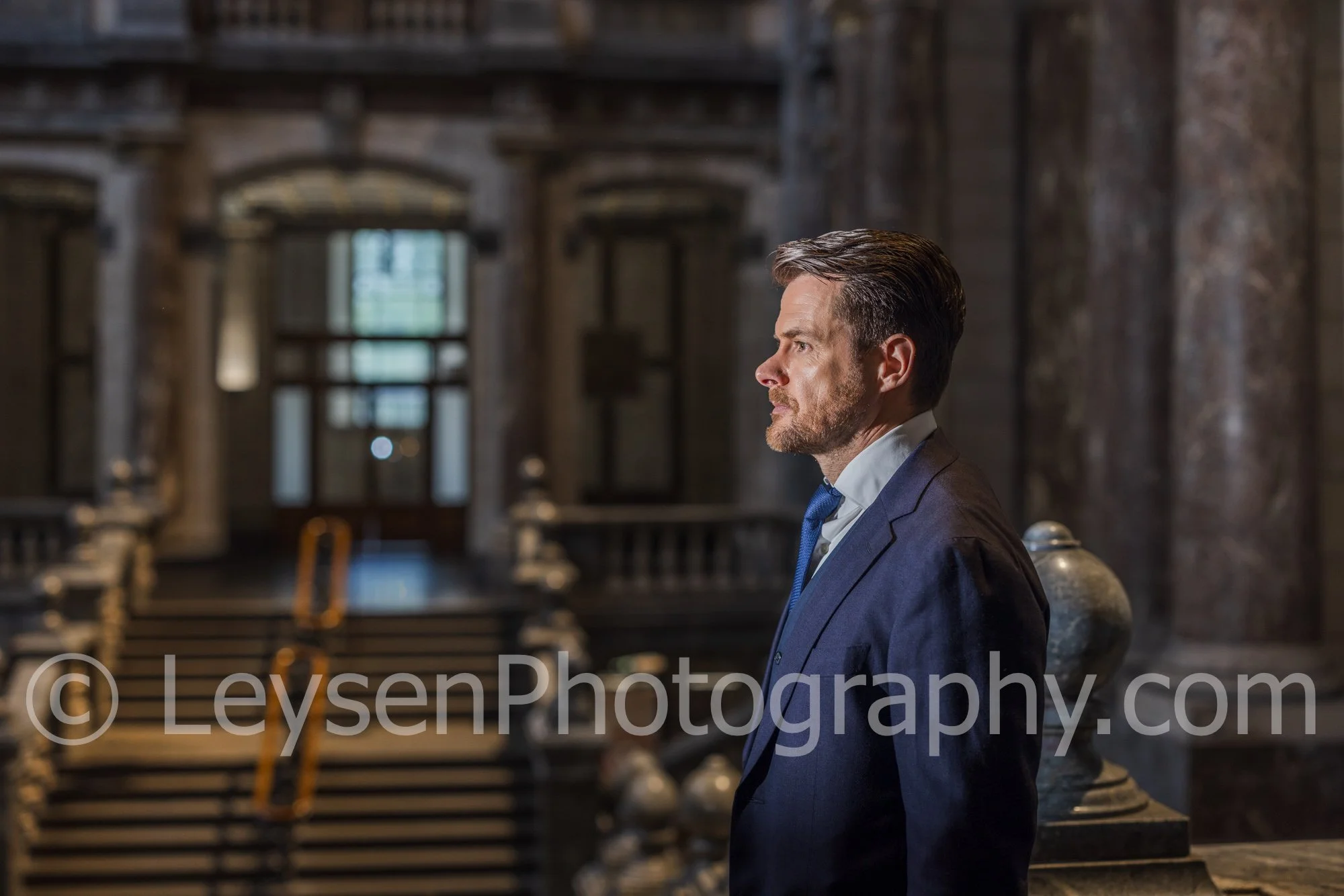 Businessman Looking to the Side in Historic Interior – Leadership Concept Photo