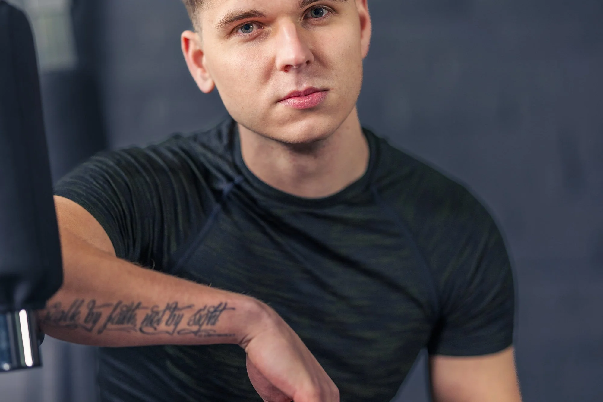 Personal trainer portrait in gym environment with confident expression, ideal for fitness branding and professional coaching visuals, fitness content