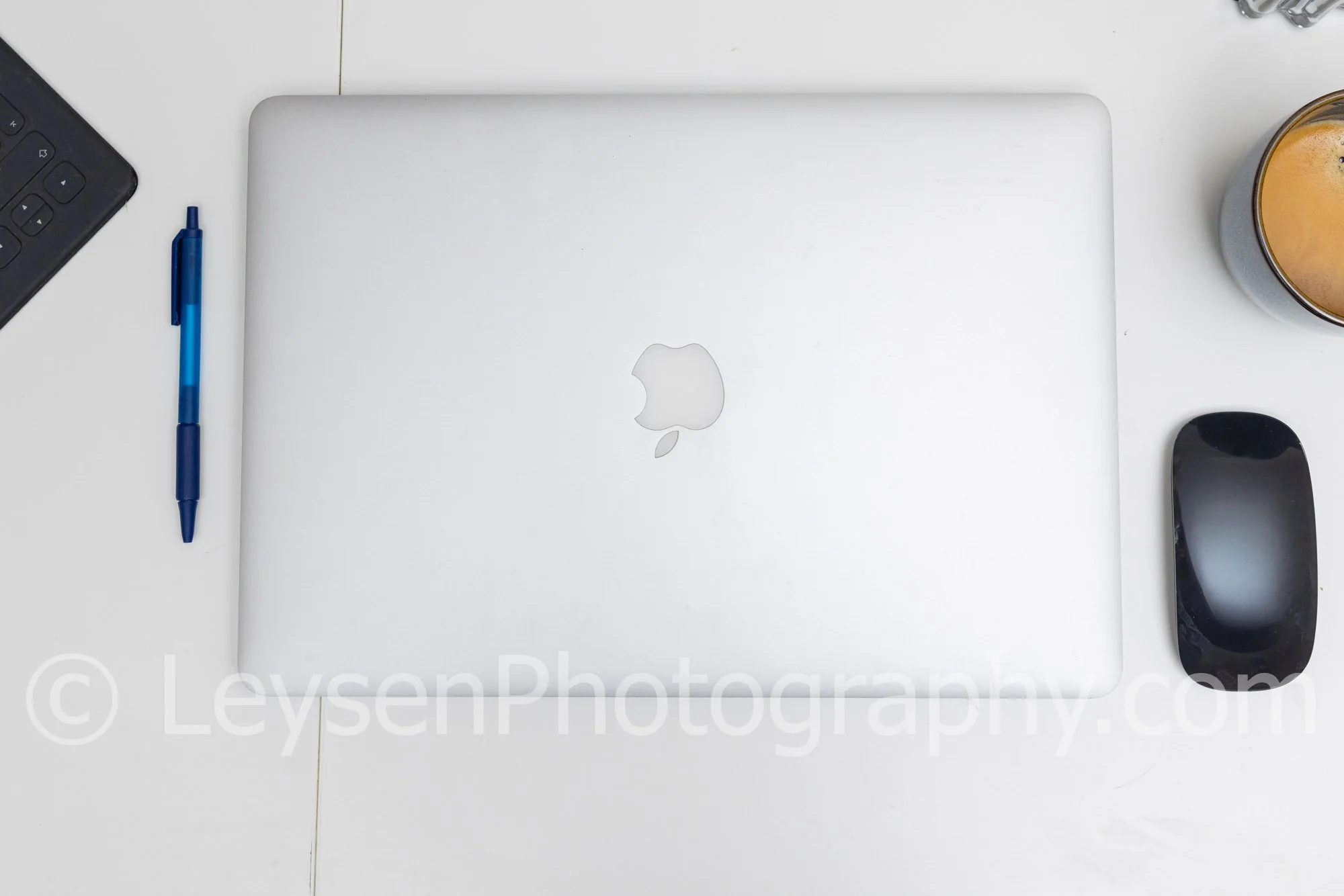 Minimal Laptop Desk Flat Lay with Coffee and Mouse – Clean Workspace Stock Photo