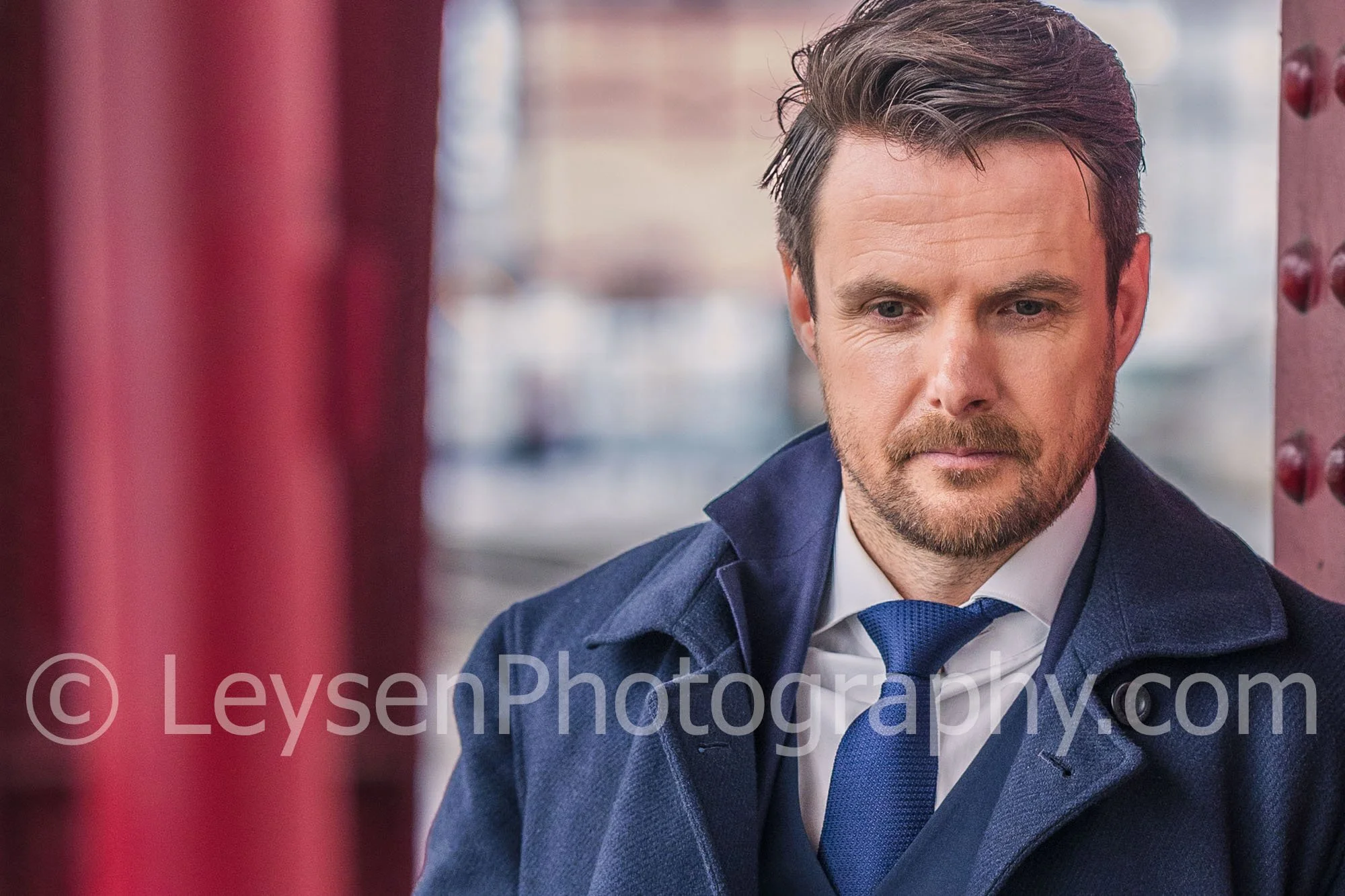 Close up portrait of elegant businessman in navy suit