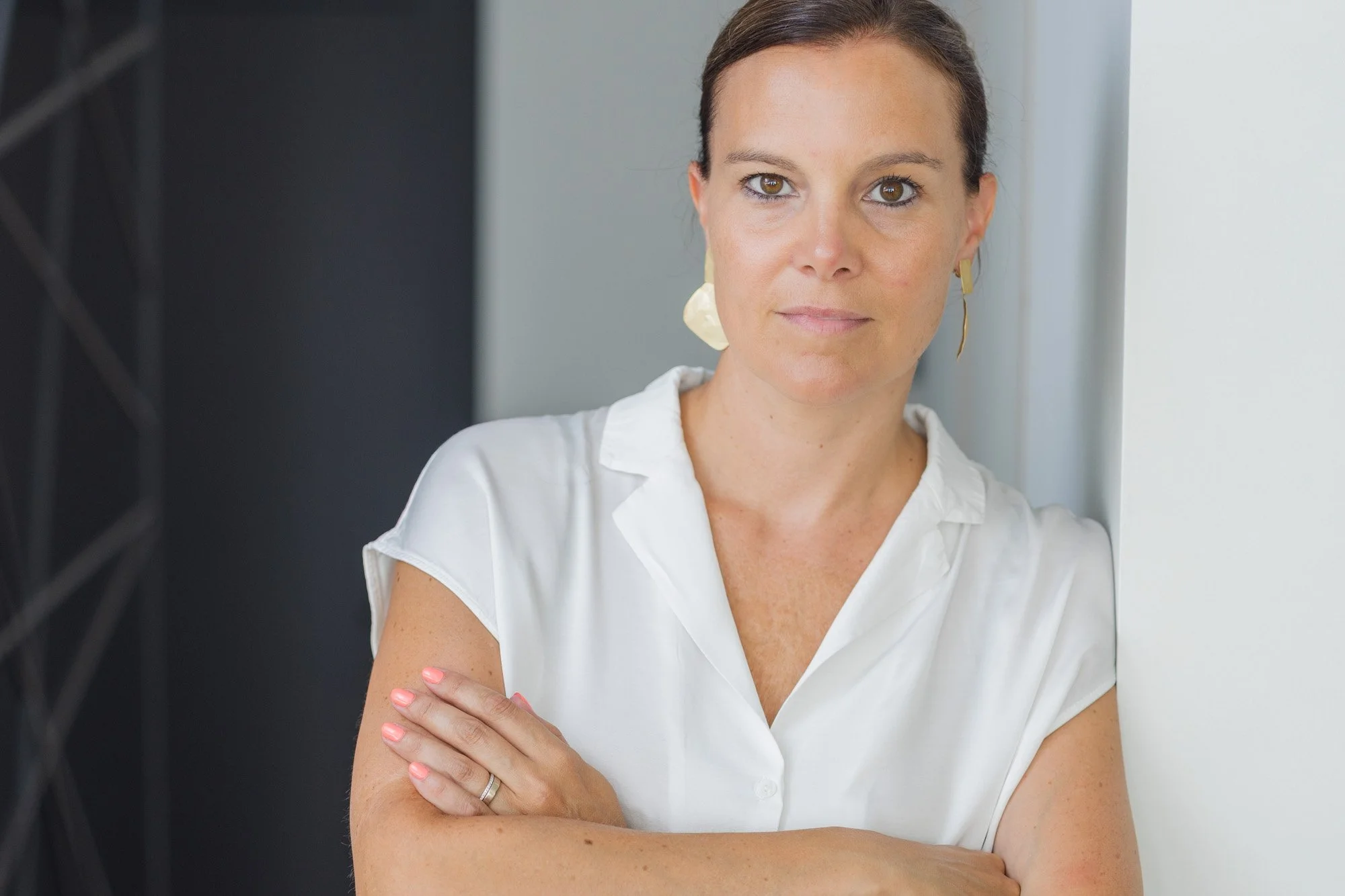 professional branding photography portrait of a confident business woman with clean composition and natural light