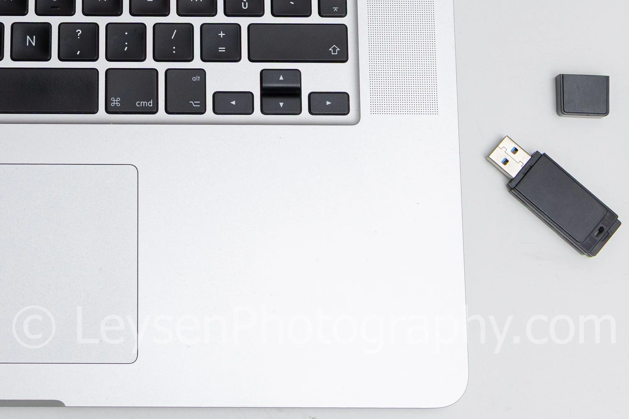 Minimal Laptop Workspace Flat Lay with Coffee and USB Drive