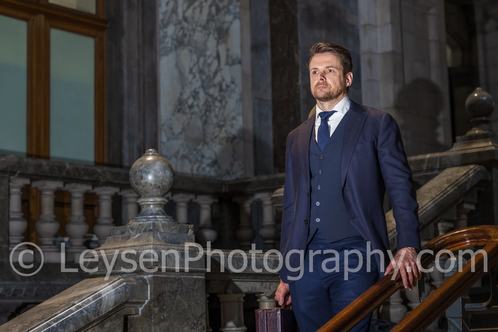 Confident Businessman Standing on Staircase – Professional Corporate Portrait