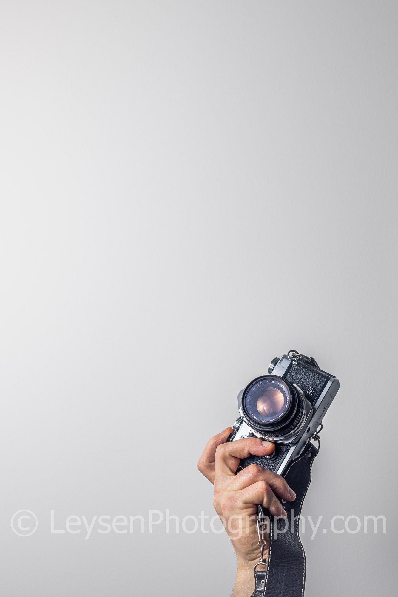 Hand - Camera - Retro - Olympus - negative space-2.jpg