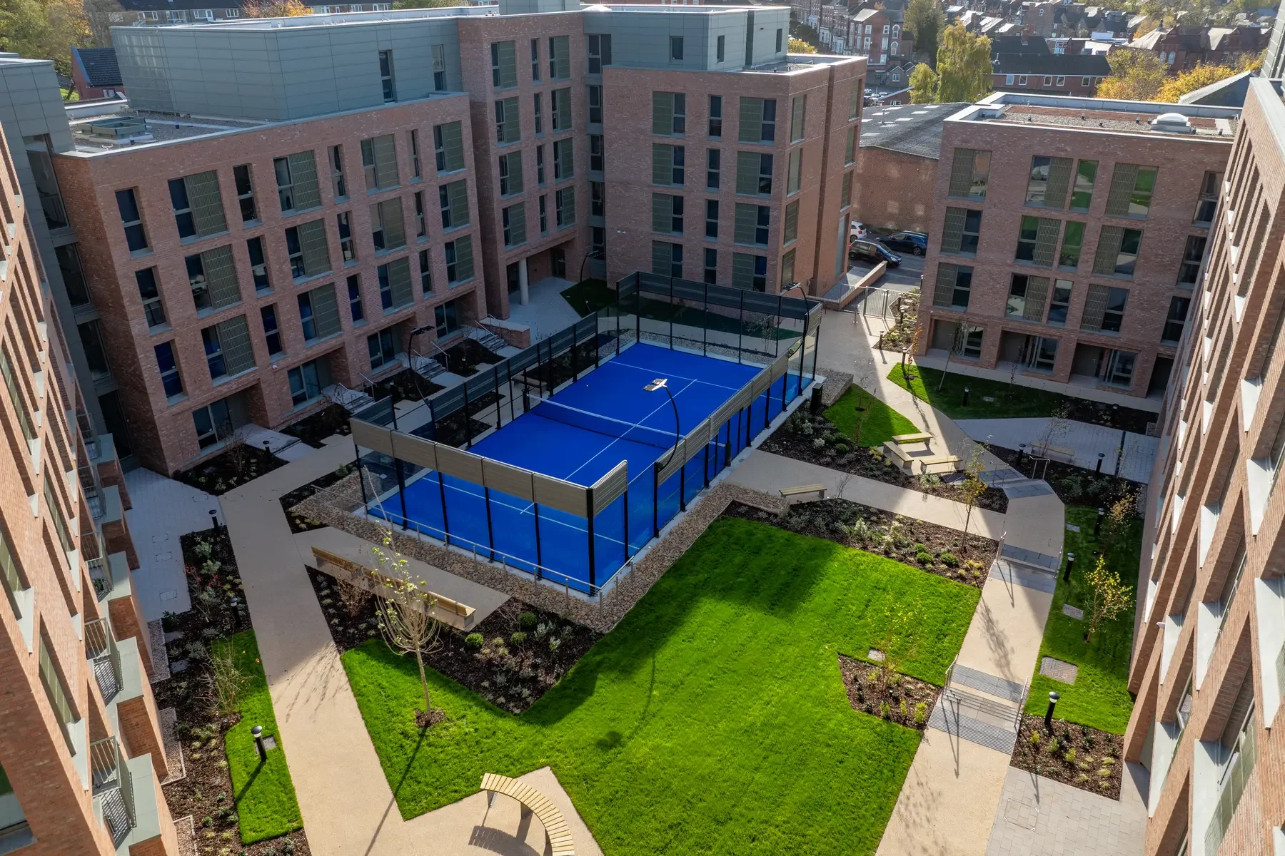 Aerial shot of a Padel Court in the middle of student accommodation in the UK