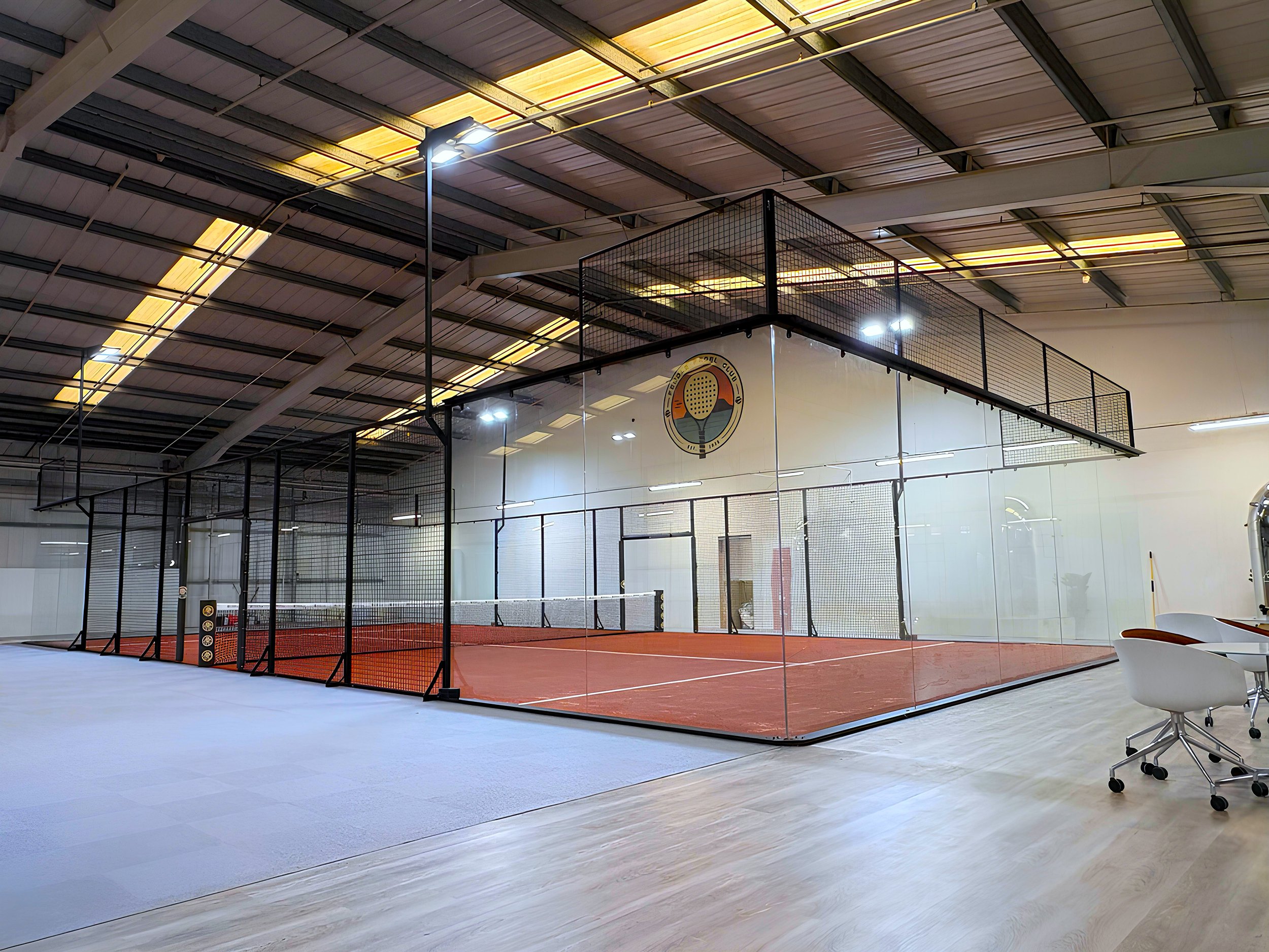 Indoor Panoramic Padel Court with custom terracotta turf, UK Pendle Padel Club