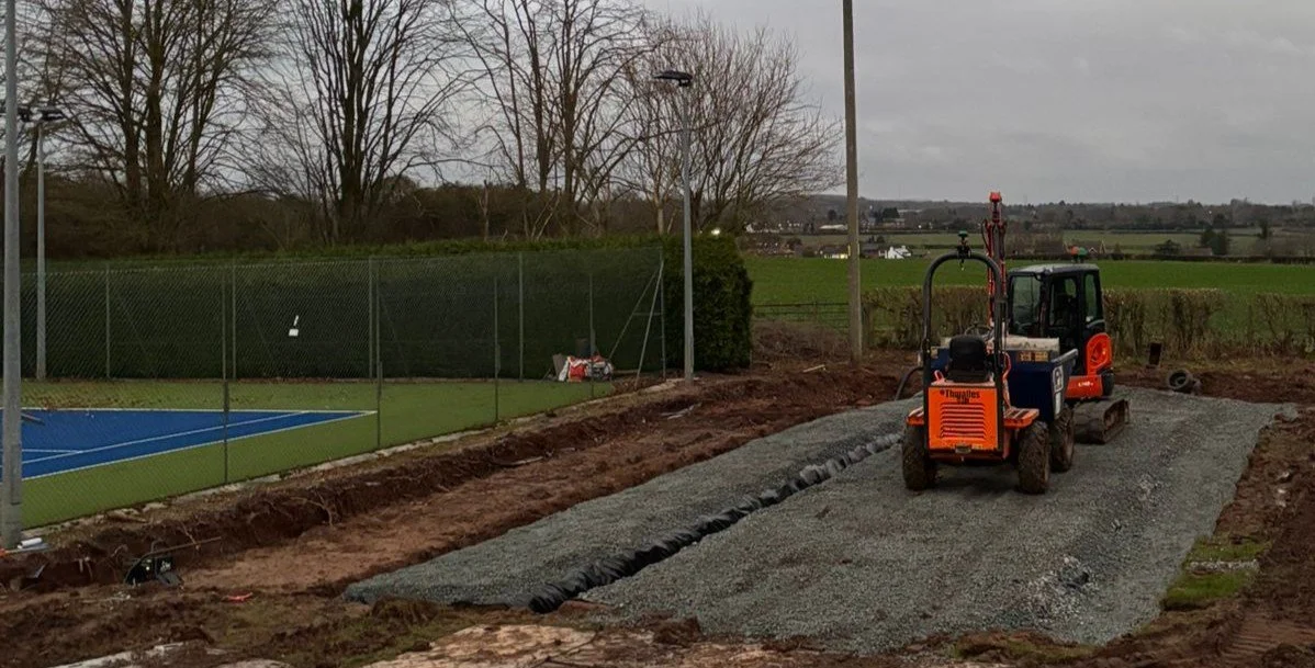 A Padel Construction site next to a tennis court