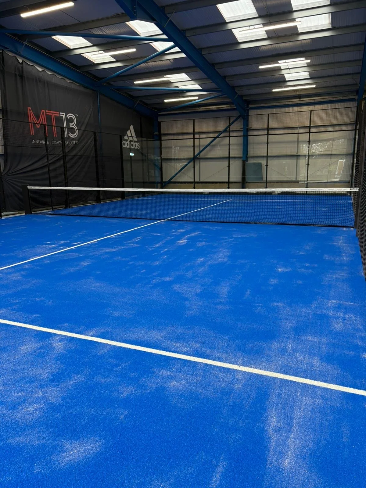 Indoor blue UK Padel Court at the Rally Hub