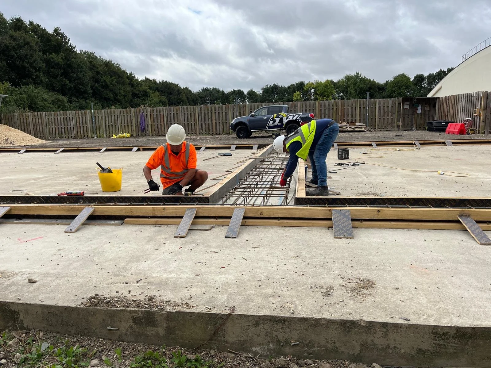 Construction workers Building Padel Courts at the University of Cambridge.