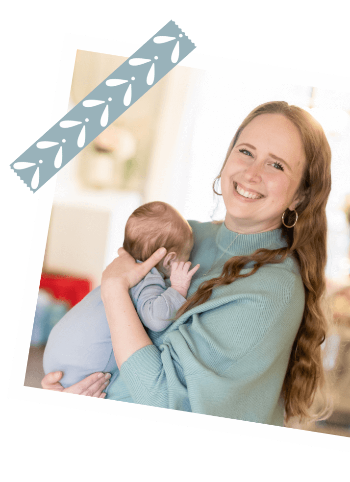 The NICU Translator founder and NICU nurse turned doula Mary Farrelly holds a newborn baby.