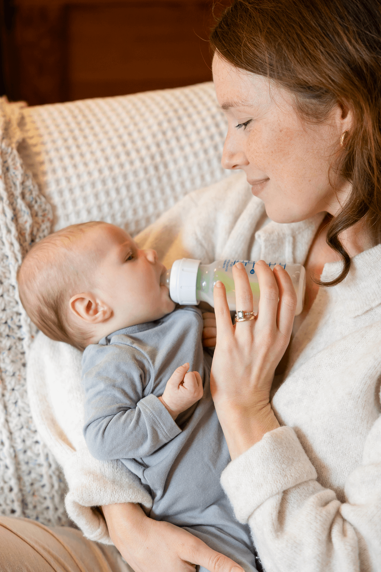 The NICU Translator founder Mary Farrelly feeds a newborn as a NICU nurse turned doula.