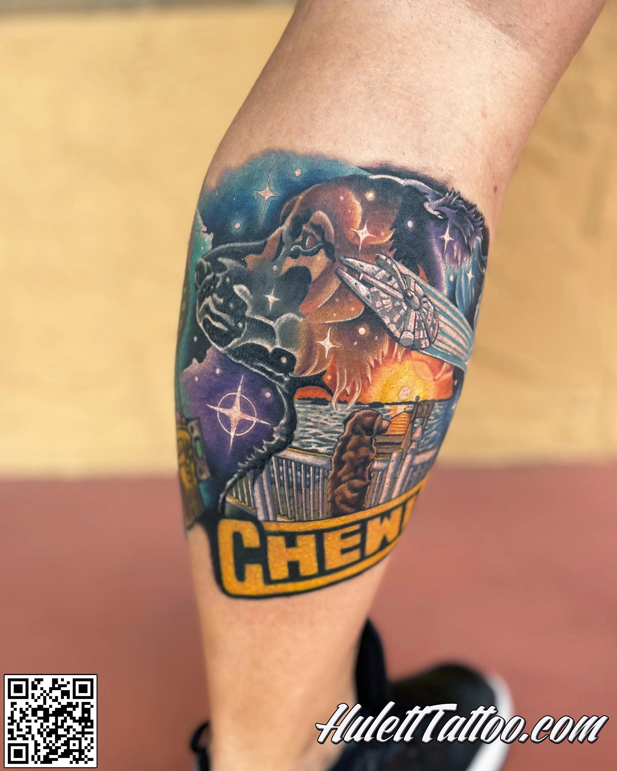 Colorful tattoo on a person's leg depicting a lion's face, a spaceship, stars, a sunset over the water, and the word 'CHEM' in bold yellow letters.