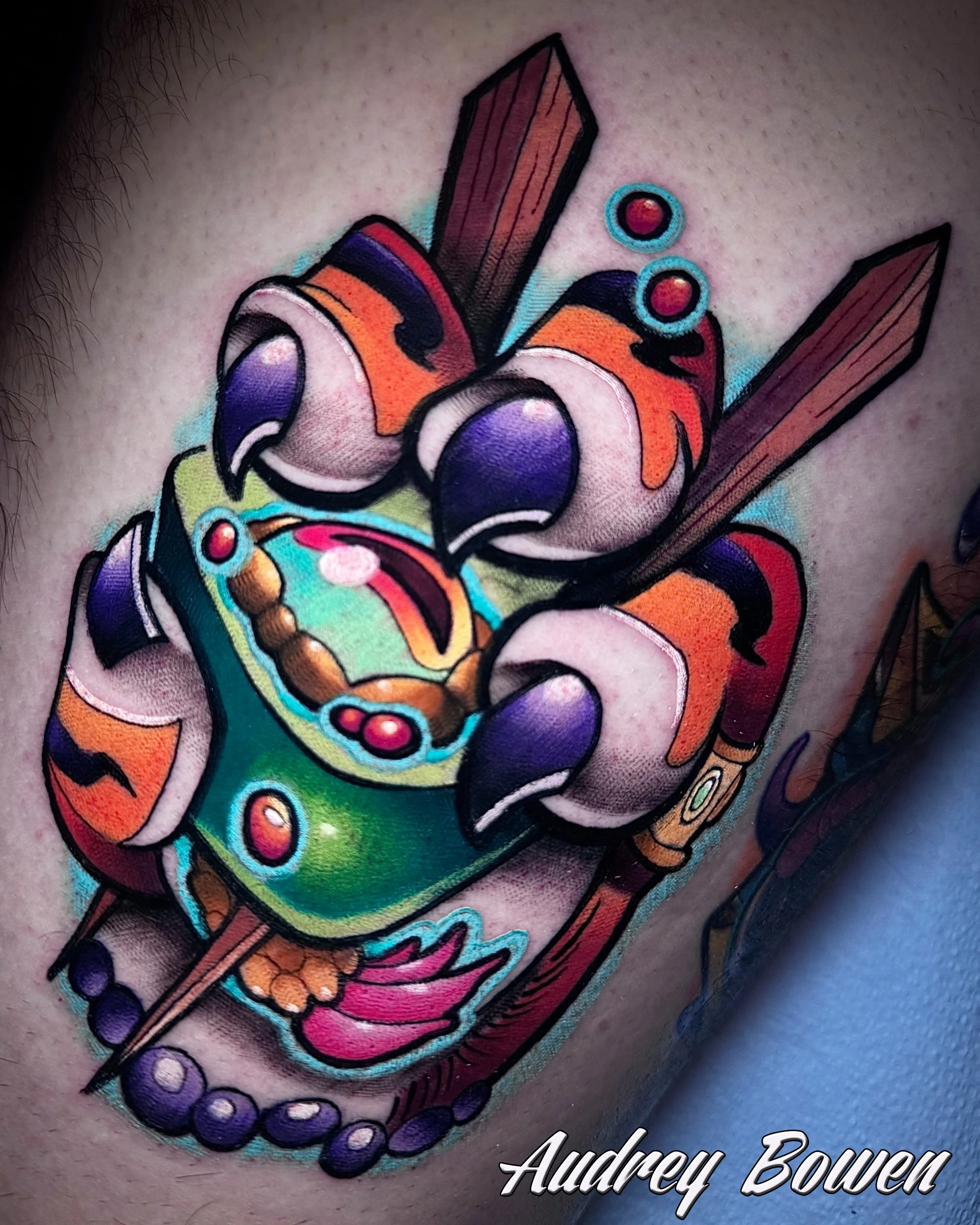 Colorful tattoo of a cartoon-style tiger paw, and pink and purple shading tattoo. Tattoo by Audrey Bowen, Karmic Tattoo, Clearwater Florida