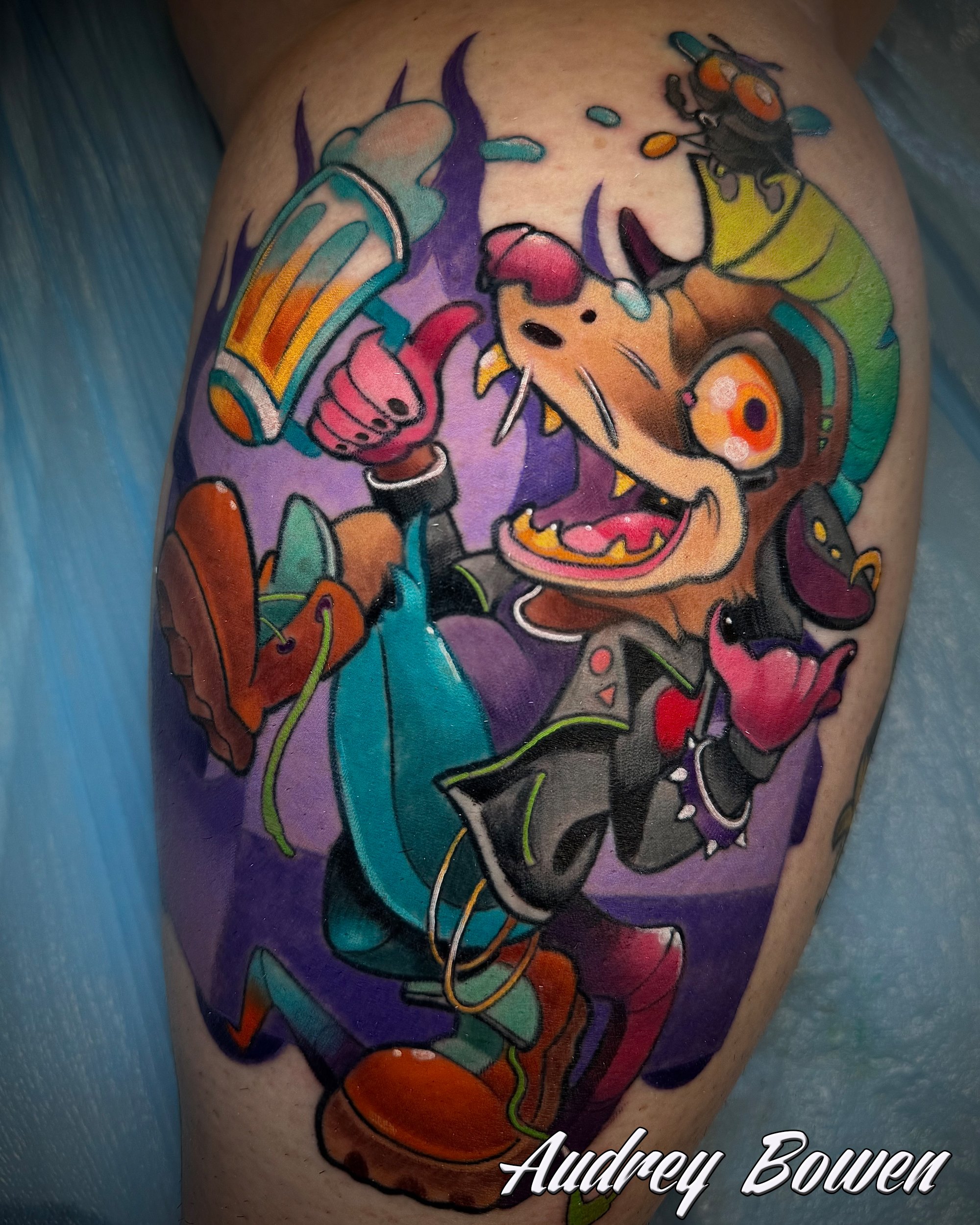 Colorful tattoo of a party rat with headphones, a rainbow-colored drink, and abstract elements on someone's skin. Tattoo by Audrey Bowen, Karmic Tattoo, Clearwater Florida