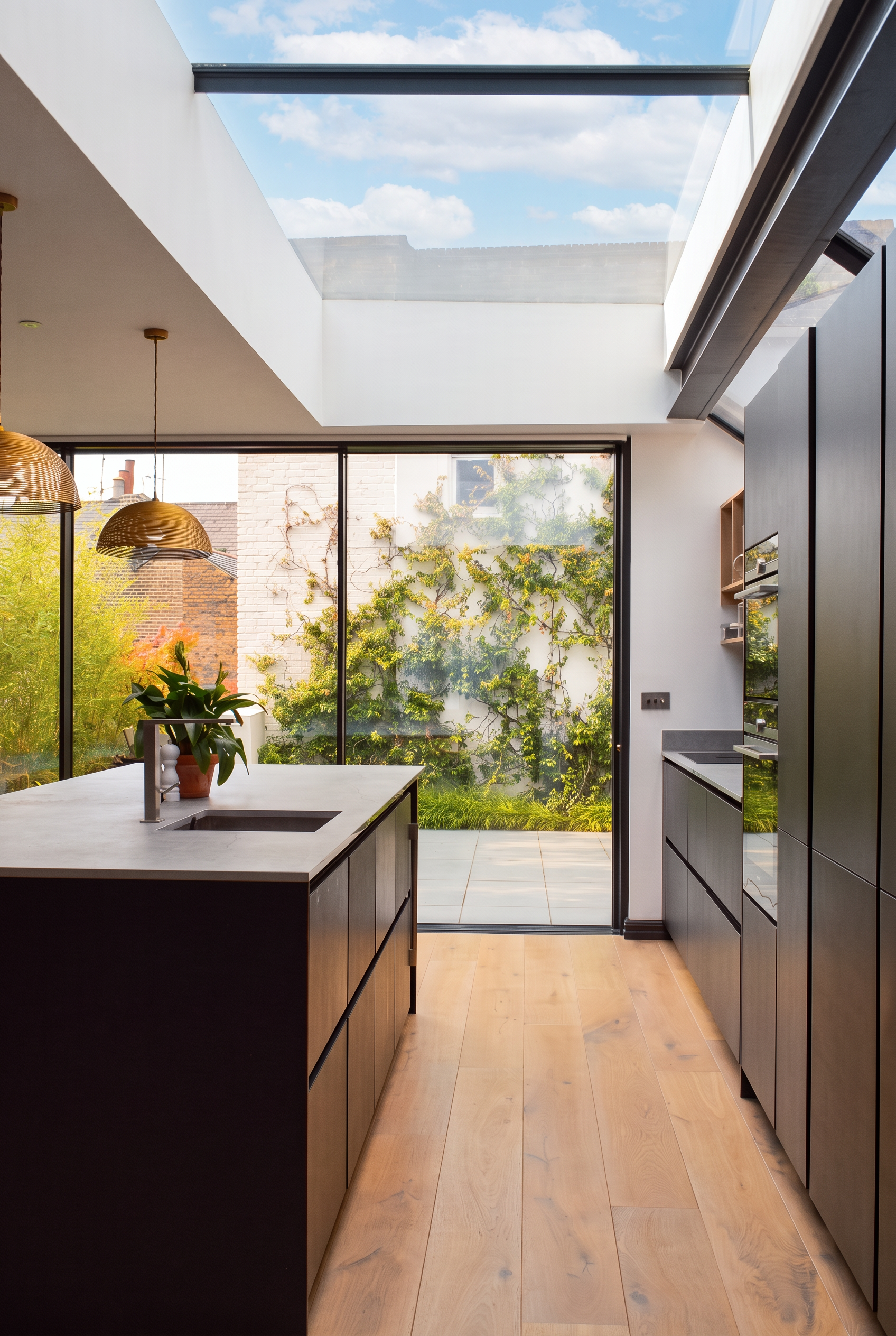 sunlit modern kitchen with glazing.png