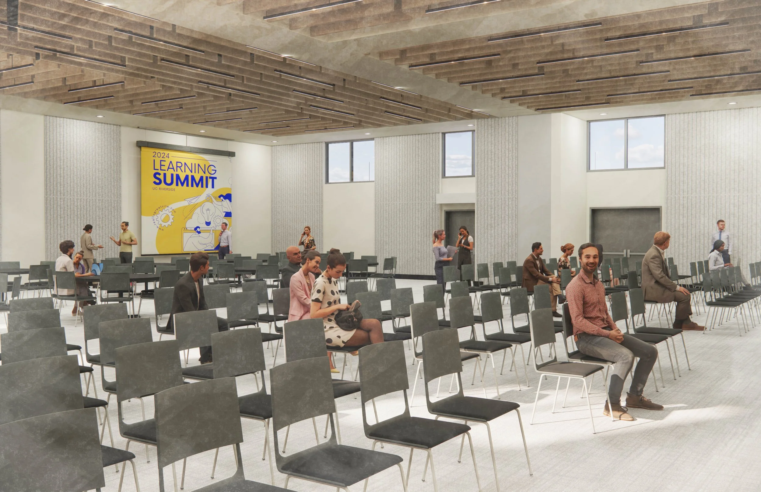 A conference room with rows of empty chairs and a few people seated or standing, with a large yellow poster on the wall that reads '2024 Learning Summit' and shows a lightbulb illustration.