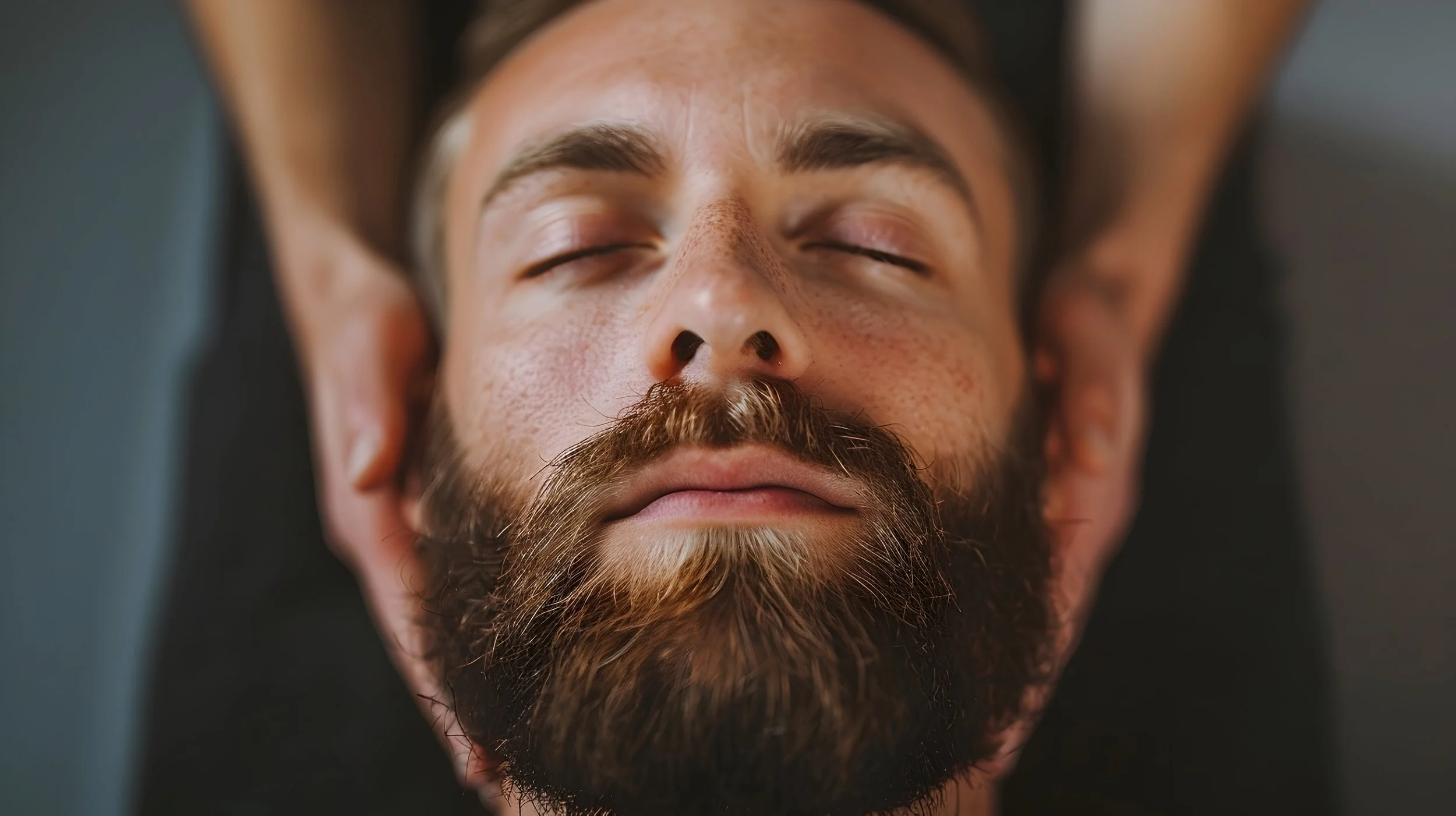 Man reciving reiki AdobeStock_1120336087.jpg