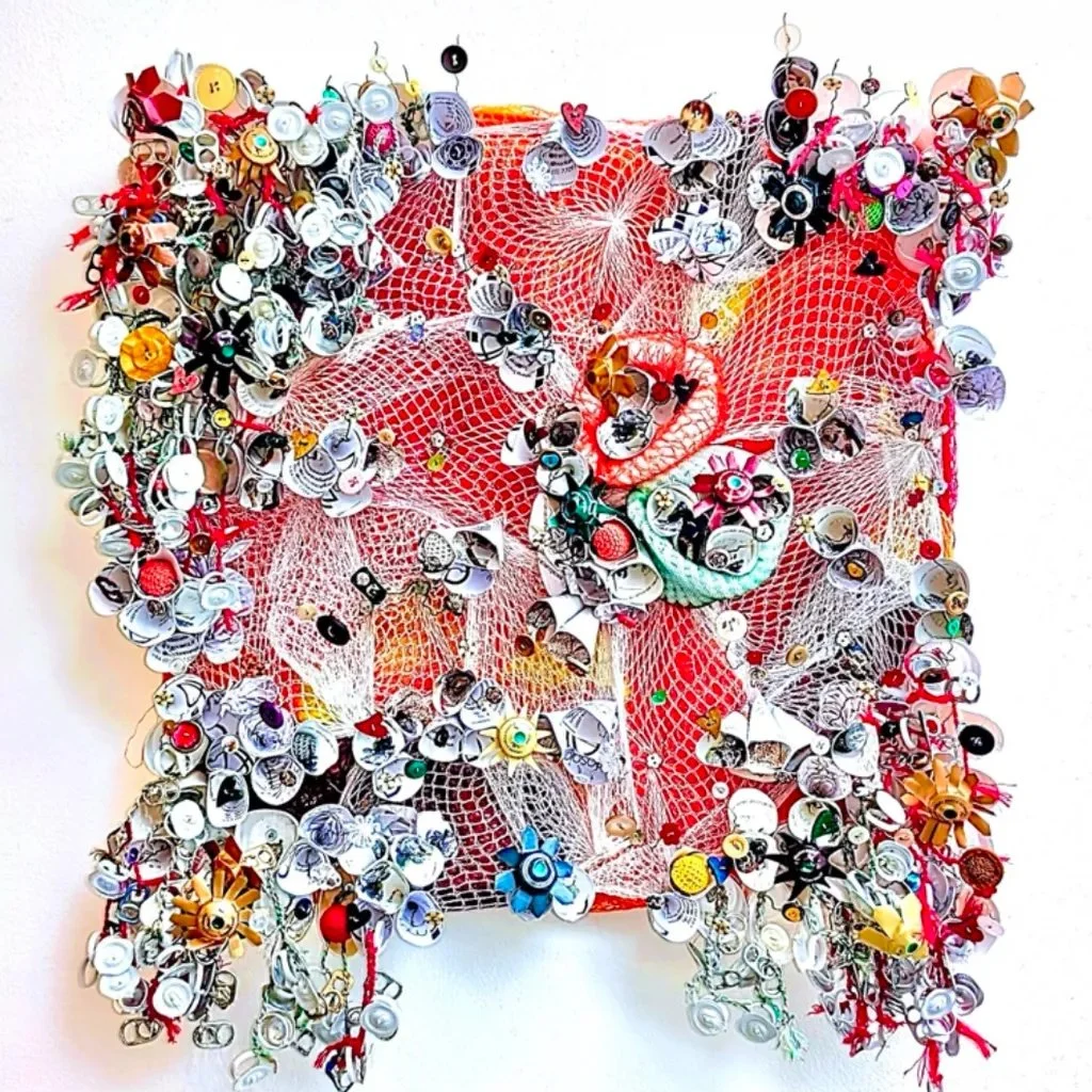 What looks like a bloom is often built from the unexpected. This piece gathers recycled fragments into something that feels alive &mdash; layered, tactile, and full of movement. I love how found materials can carry their own history while becoming pa