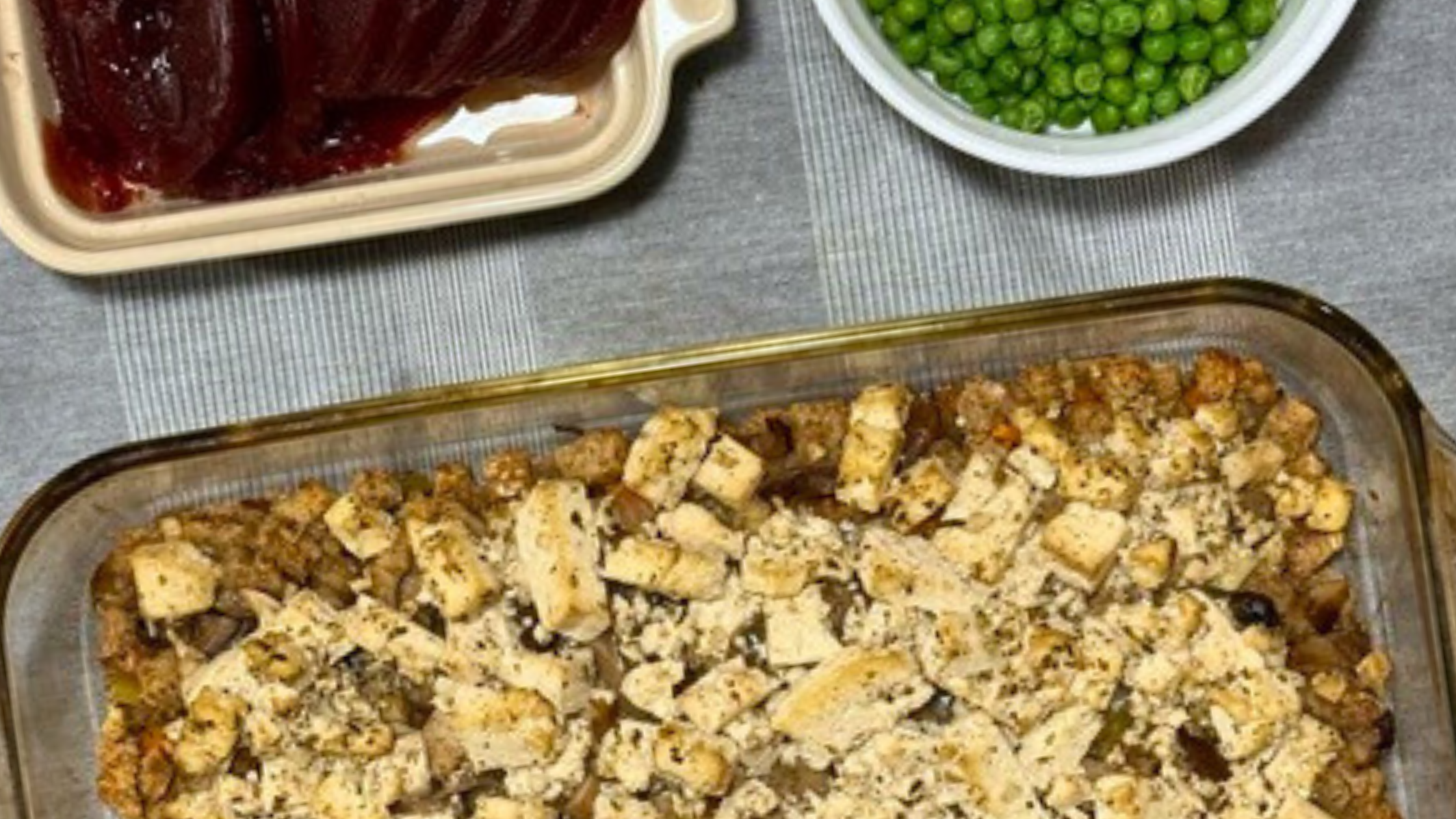 Carol Barnett's whole-food plant-based unturkey casserole, pictured with cranberry sauce and peas on the side.